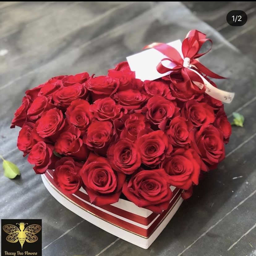 Queen Of Hearts - Santa Clarita Florist - This beautiful heart shaped arrangement is designed to deliver happiness to your loved ones day. Filled with beautiful Roses and customized to perfection, this arrangement is a showstopper! If you want to turn heads then this is the arrangement for you! 