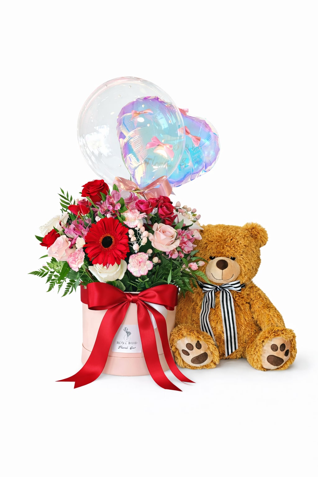 The Ultimate Valentine — Love Note Hatbox  - When only the most extra, most thoughtful, most unforgettable gesture will do—this is it. Our Ultimate Valentine features the signature Love Note Box, designed with a lush mix of seasonal blooms in romantic reds, soft pinks, and creamy whites, paired with two luxe Valentine’s balloons, a large keepsake teddy bear, and a full-size handwritten card for your personal message. This all-in-one Valentine’s moment is made to stop them in their tracks—perfect for proposals, milestone anniversaries, or simply going all out for the one you love. Includes: Love Note floral box (designer’s choice, seasonal blooms) Two luxe Valentine’s balloons Large teddy bear keepsake Full-size handwritten card with your custom message Thoughtfully curated. Beautifully delivered. Impossible to forget.