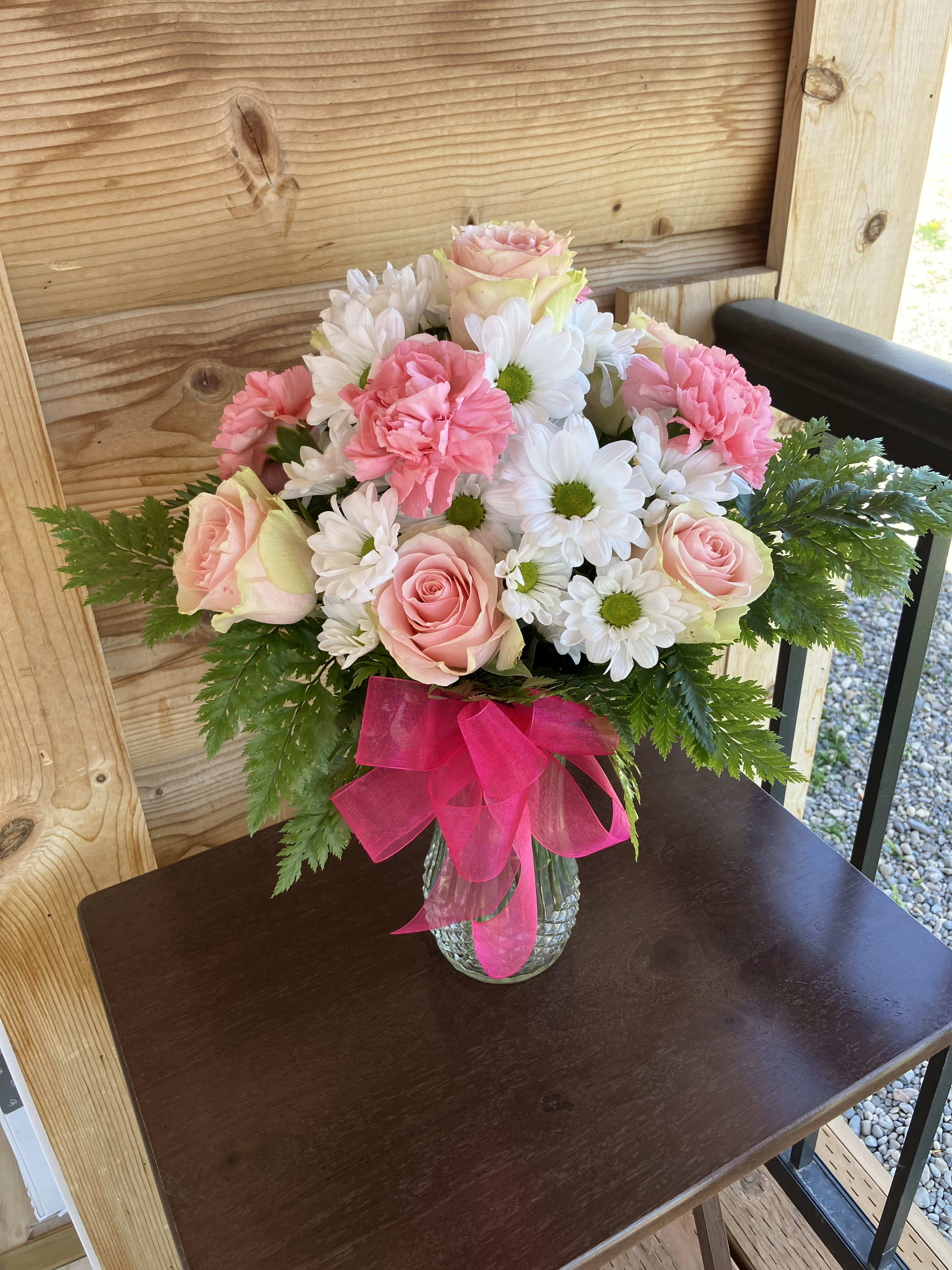 Pink And White Bouquet - This bouquet has pink roses, pink carnations, and white daisies and will bring absolute joy to someones day!