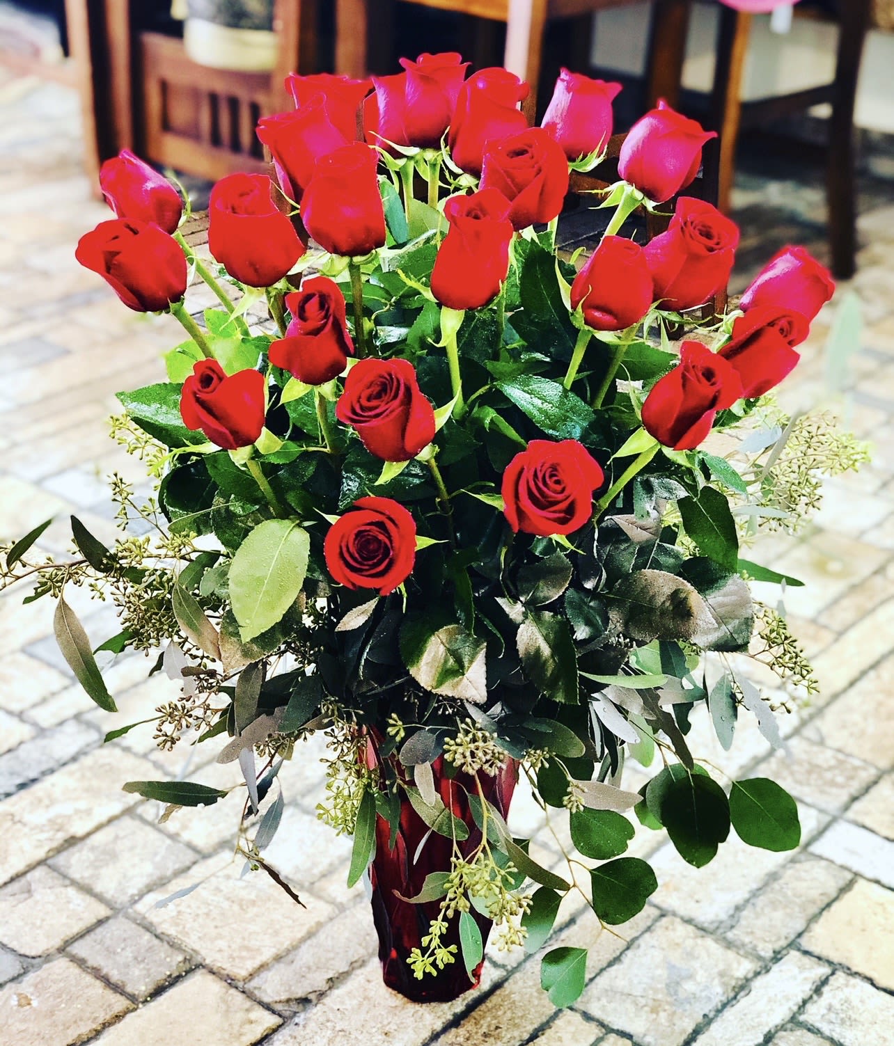 24 Red Roses Bouquet  - 24 Red Rose Bouquet A breathtaking expression of deep love and romance, this lavish bouquet features twenty-four premium red roses gathered with lush greenery. Red roses are the ultimate symbol of passion and devotion, making this arrangement perfect for grand romantic gestures, anniversaries, or unforgettable Valentine’s moments. Elegantly hand-tied and beautifully wrapped, this bouquet delivers timeless beauty and a powerful message straight from the heart.