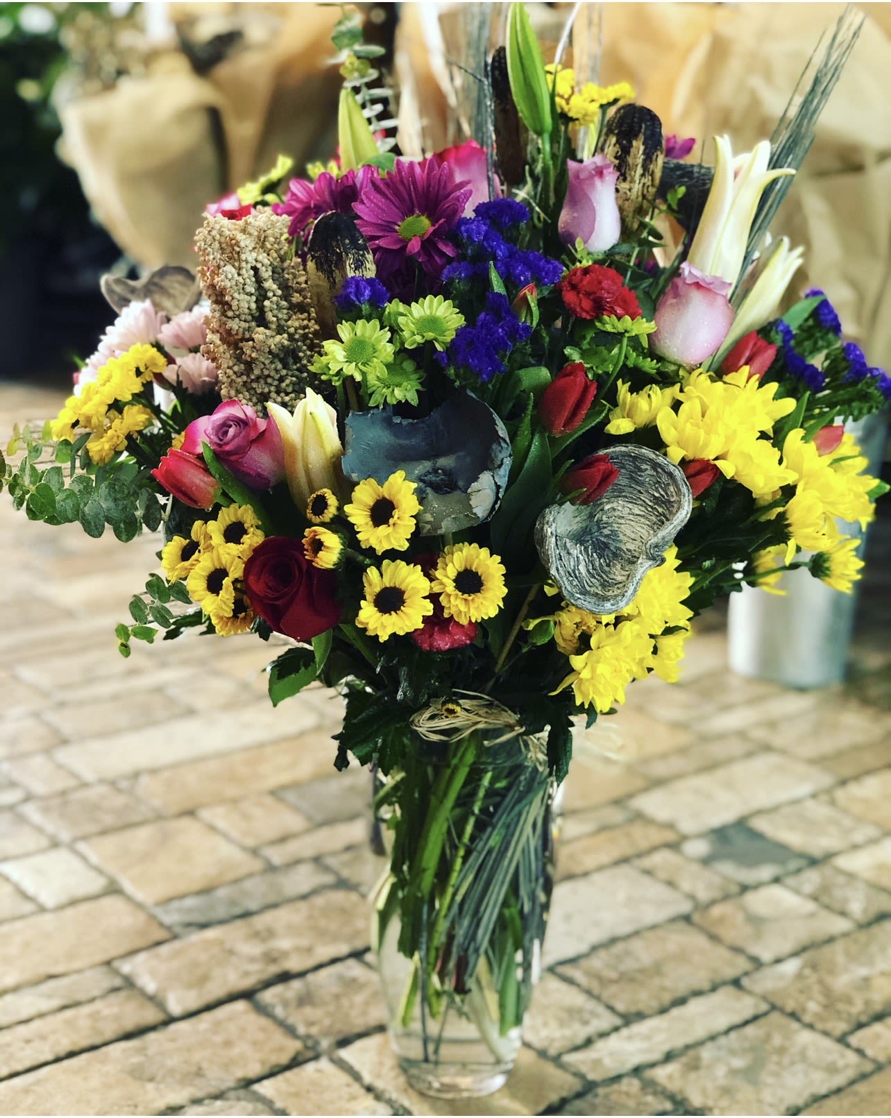 Love in Full Blooms  - Love in Full Blooms  is a romantic bouquet that celebrates the magic of love in every bloom. This elegant arrangement features a vibrant mix of roses, seasonal flowers, and delicate accents in rich reds, soft pinks, and pastel hues. Carefully arranged to create a harmonious and full display, it captures the essence of romance and heartfelt emotion. Perfect for Valentine’s Day or any special moment, it’s a beautiful way to say our love is a story that blossoms with every day. 