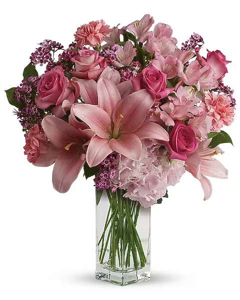 Country Picnic Bouquet - The pastel colors in this enchanting bouquet are soft, but your message of "I'm thinking about you today," will come in loud and clear. A beautiful array of delightful blooms including light pink hydrangea, asiatic lilies, alstroemeria, pink roses, lavender waxflower and pretty salal are delivered in a delightful Teleflora Bunch Vase.