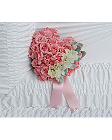 Divine Serenity Casket Insert - A heartfelt tribute to your love, this sweet pink rose heart is adorned with delicate white orchids for an uplifting casket arrangement. White dendrobium orchids and pink spray roses are accented with dusty miller and light pink ribbon. Approximately 6 1/2" W x 10" H