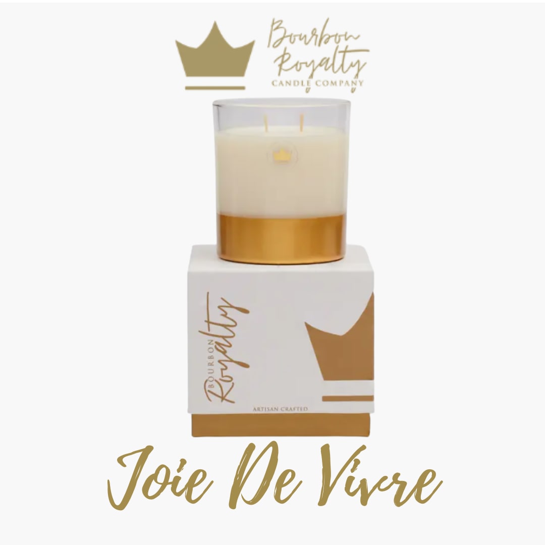Bourbon Royalty - 14oz Boxed Glass Candle - Joie De Vivre - Beautifully boxed this candle is the perfect ready made gift to accent any arrangement large or small.   From the Makers: Elegantly gilded with the Bourbon Royalty crown, this candle exudes opulence. Being double wicked, it burns for 45-55 hours, casting a warm, captivating glow. Housed in a custom box, it's a perfect gift or a luxurious addition to your space. Elevate your ambiance with this regal masterpiece.  ****PLEASE NOTE**** We are unable to deliver this candle by itself. If only looking to purchase the standard level of this candle, it can be picked up in store. Our Minimum for Delivery is $50. If the items in your cart total over this amount (for example, the candle and a floral arrangement) we can deliver it.