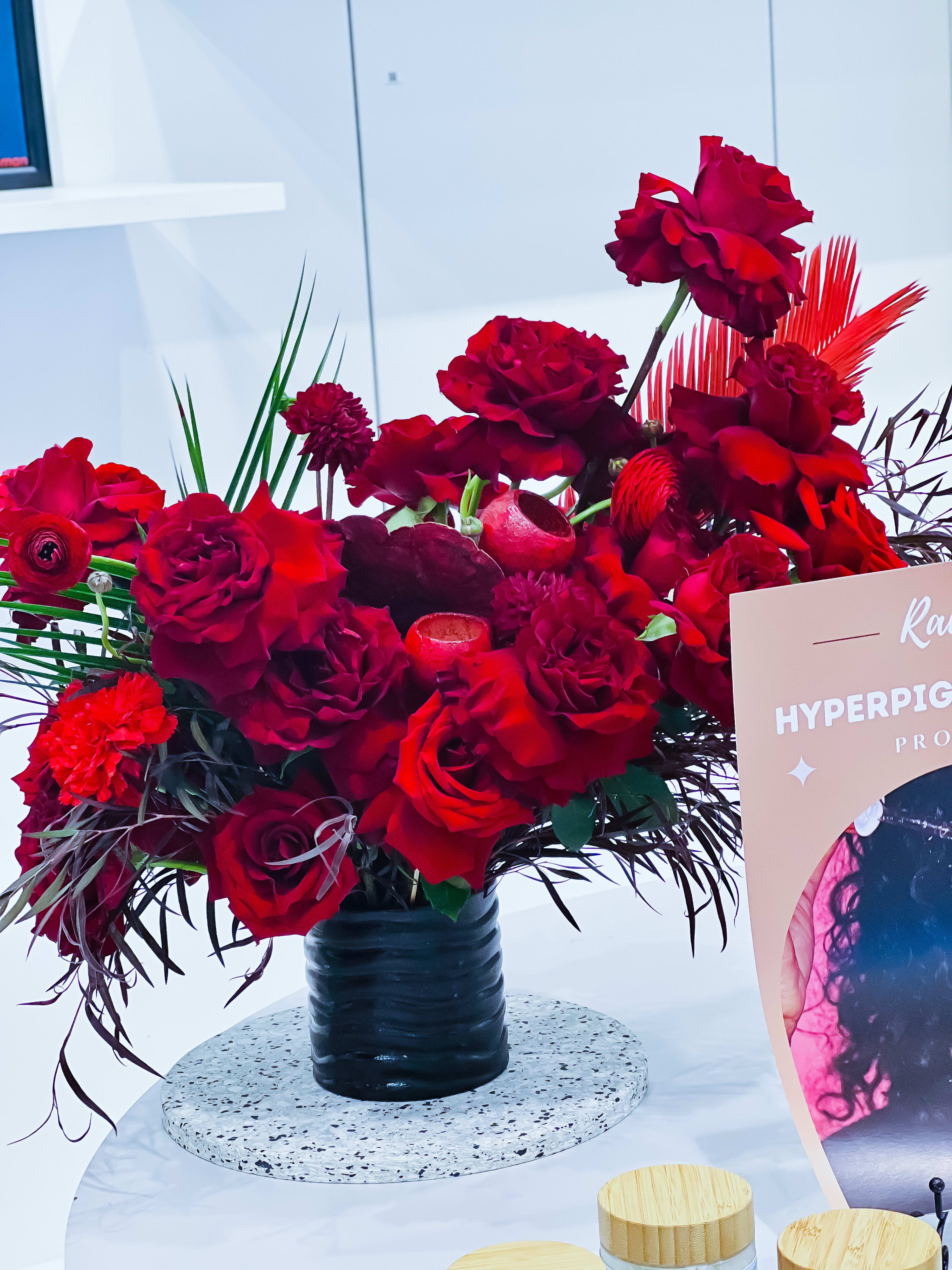 Glam Monochrome  Red Roses Designer Choice - These will be designer choice red roses. The design will be similar to thee photo in a white or black vase. No one design will be the same. But guarantee she will love them. 