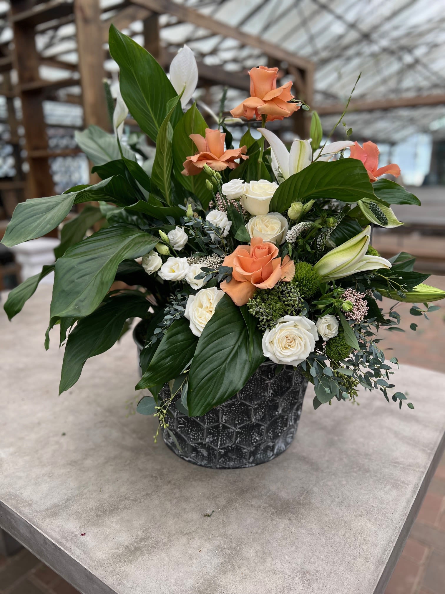 Blowing in the Wind - A mixture of a large plant and fresh floral blooms. 