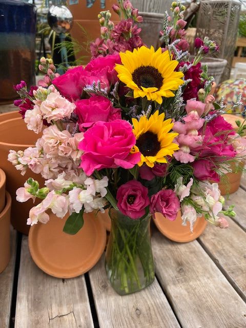 Here Comes the Sun - A bright and vibrant mixture of in season blooms. This one is a head turner with all of its color!