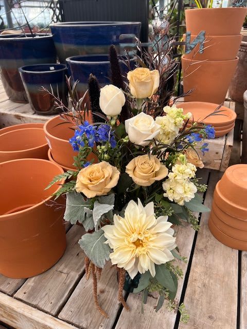 House of Memories  - Light roses, dahlias and texture galore make this arrangement stand tall compared to the rest.