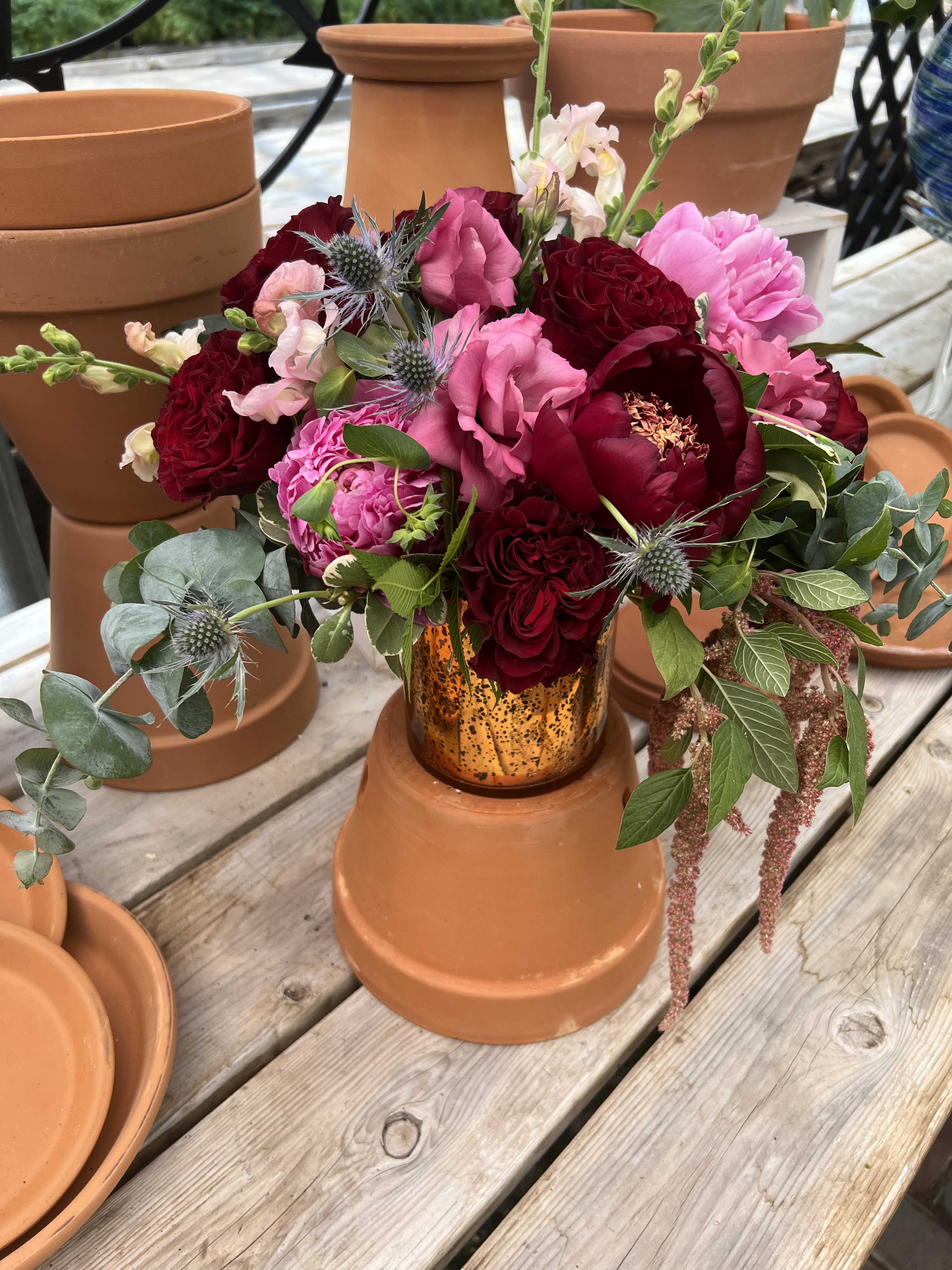 Lovely Day - A mixture of large blooms that will leave your breathless. Maroons and pinks explode in this bouquet.