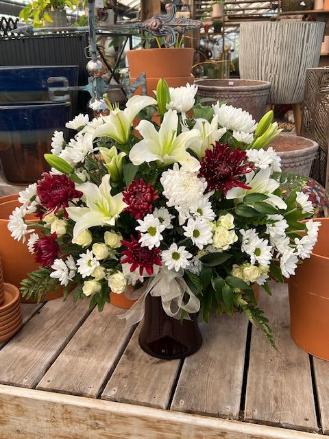 Sympathy and Honor - A traditional mixture of blooms in a vase