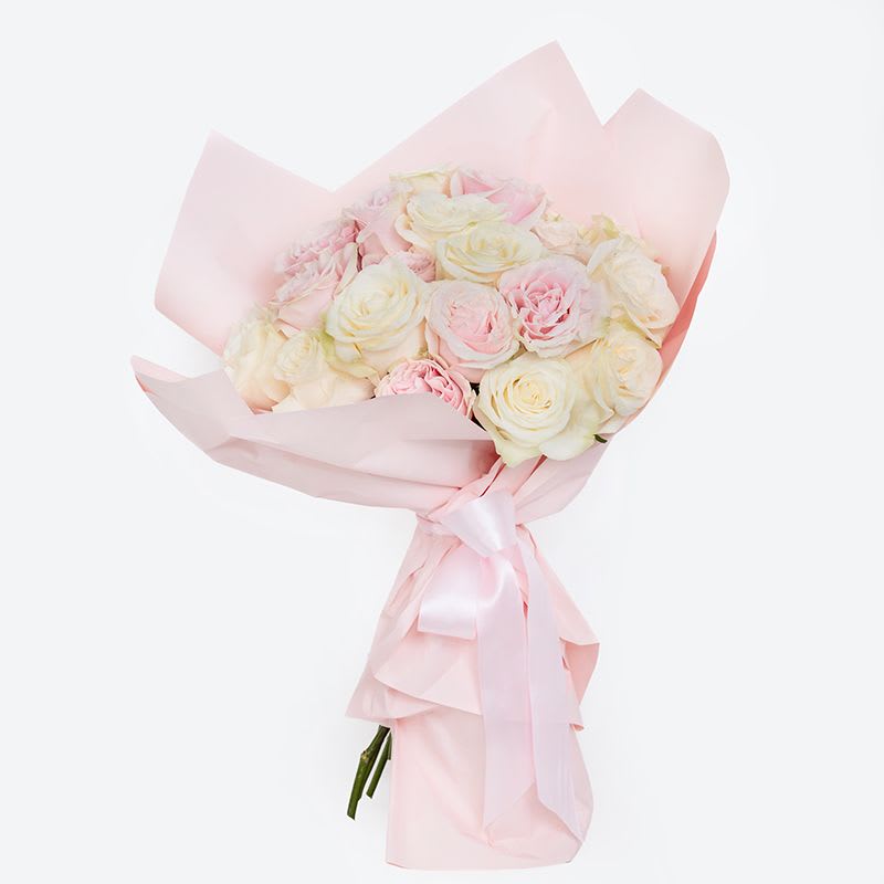 Pink &amp; White Cloud Rose Bouquet - The Pink &amp; White Cloud Rose Bouquet is a romantic Valentine’s Day favorite, designed to feel soft, airy, and effortlessly luxurious. This hand-wrapped bouquet features 25 premium stems of pink and white roses, artfully arranged to create a cloud-like fullness and wrapped in custom translucent paper for a modern, elegant finish.  Perfect for Valentine’s Day flower delivery, anniversaries, or heartfelt gestures, this bouquet symbolizes love, admiration, and timeless beauty. A hydration packet is included to ensure long-lasting freshness upon arrival.
