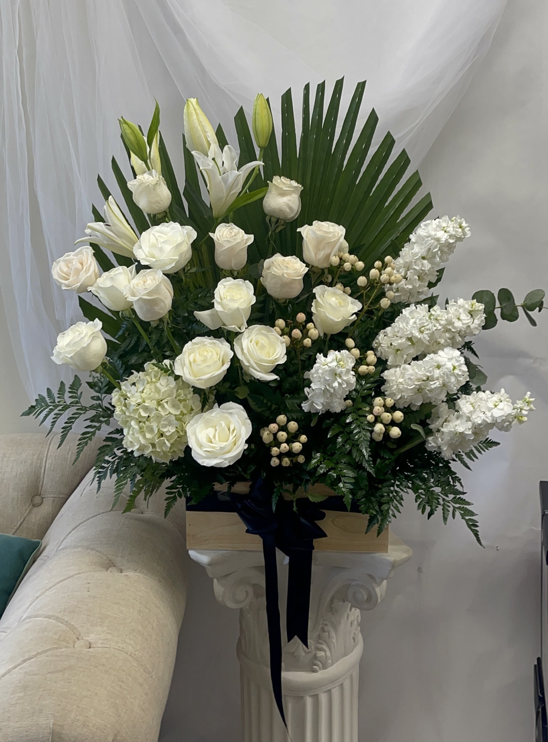 Deepest Sympathy - Theme Colors: Shades of whites and greens  Featured Blooms: Lilies, Roses, Hydrangea and Stocks  HK Flowers have a uniqueness of florals and seasonal blooms, certain flowers or colors may not be available as each season affects the availability, color, size, and shape of each floral bloom. Some flowers may be substituted accordingly.  Photos are used as a reference for the color palette and is NOT indicated of the final product. We ask for your trust in us that we will pick out the best seasonal available blooms, while still capturing the arrangements theme and colors mentioned above.