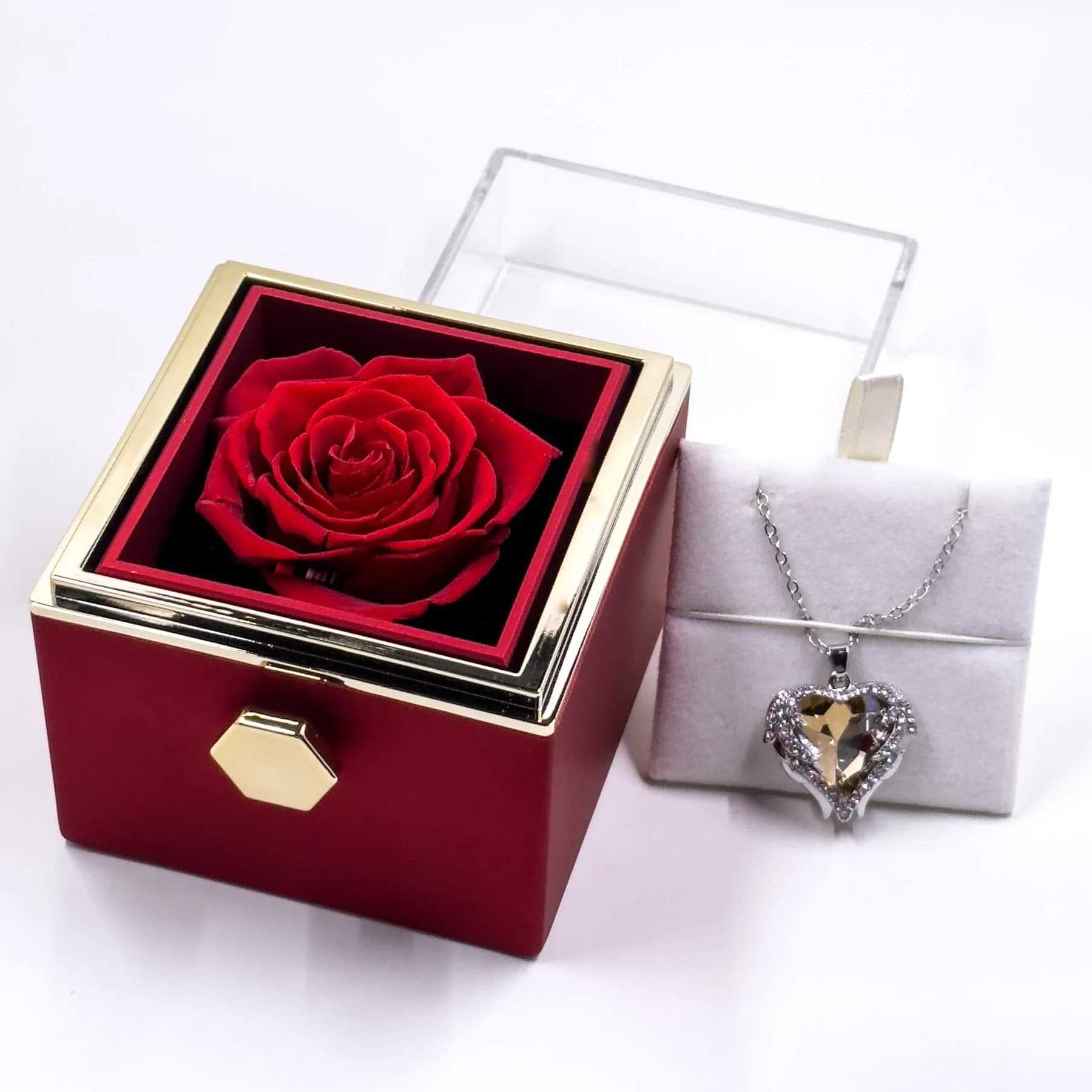 Red Rotating Jewelry Box with Heart Necklace and Preserved Rose - What better way to give your heart to your loved one other than a Rose that lasts forever along with an amazing Necklace?  A perfect Gift for Christmas, Valentine's Day, Anniversaries, Weddings, Birthdays or any other occasion  The center stone has a majestic look. Streamlined and modern, this necklace truly shines with bold simplicity. A graceful dance between sleek curves and a dazzling gem.  Features:  A real, preserved Eternal rose. This rose does not need to be watered, but it is best to keep it out of direct sunlight.  Angel Wings Pendant Necklace: 17" chain made of titanium steel. The texture is tough, corrosion-resistant, doesn't darken, and doesn't cause allergies. With diamond-encrusted craftsmanship, it is simple, stylish, noble and elegant.  Rotating Drawer Jewelry Box: The upper part of the rose gift box features a removable transparent acrylic transparent cover that protects the preserved rose. The jewelry box features a rotating drawer, with the pendant secured on one side, and the rose on the other. Other Jewelry such as earrings, necklaces, rings, brooches can be stored as well in the box.