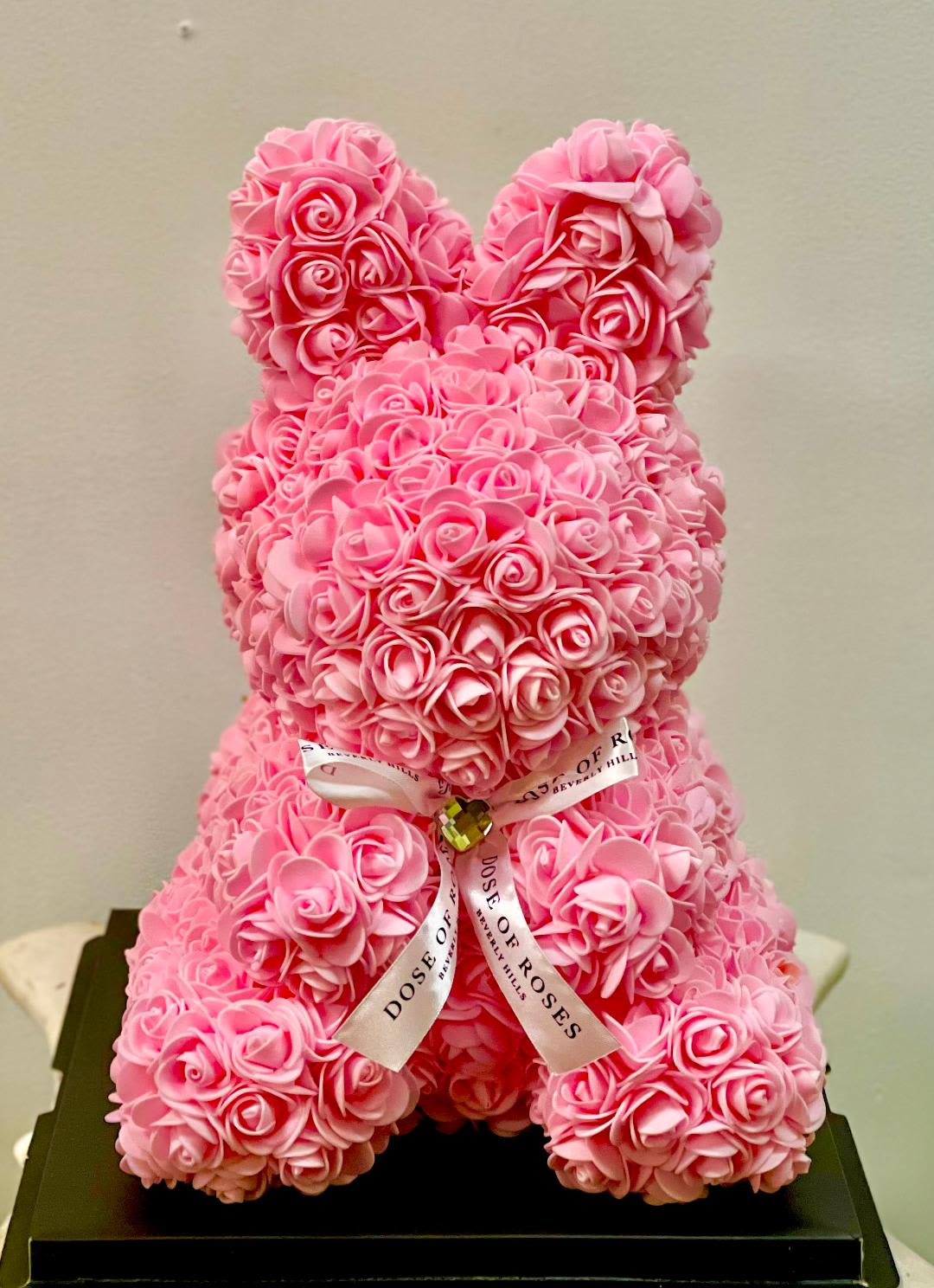 Pink Bunny Teddy Bear  - Pink Bunny rose bouquet.  color: pink  _Crafted with premium pink faux Foam roses. _16"/11" Teddy bear adorned with a black ribbon. _Comes in a custom acrylic box for a lasting impression.  Perfect for Valentines Day, Birthday, Mother's Day, Anniversaries&amp; Baby shower. 