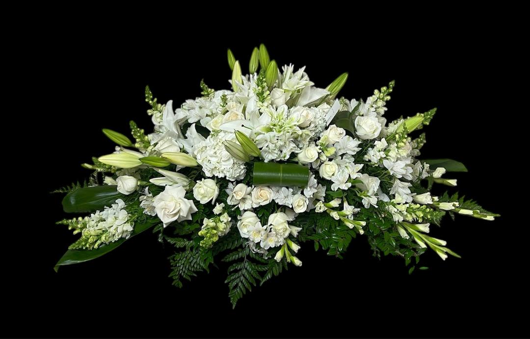 White Caskets - Roses, lilies, snapdragon, gladiolus, Hydrangeas and more come together for a white casket spray. Sized to fit both open and closed caskets. 
