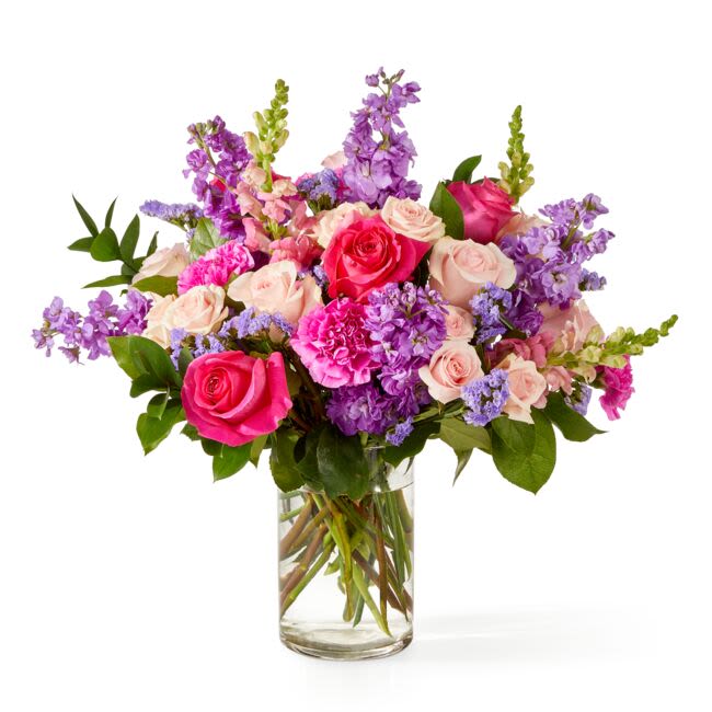 MILES RIVER GARDEN - The Miles River Garden is an ode to enduring romance and cultivated ease..  Designed in layered shades of pink, lavender and  blush, this arrangement brings together garden roses, stock and snapdragons in a manner that feels generous, abundant, and quietly confident.