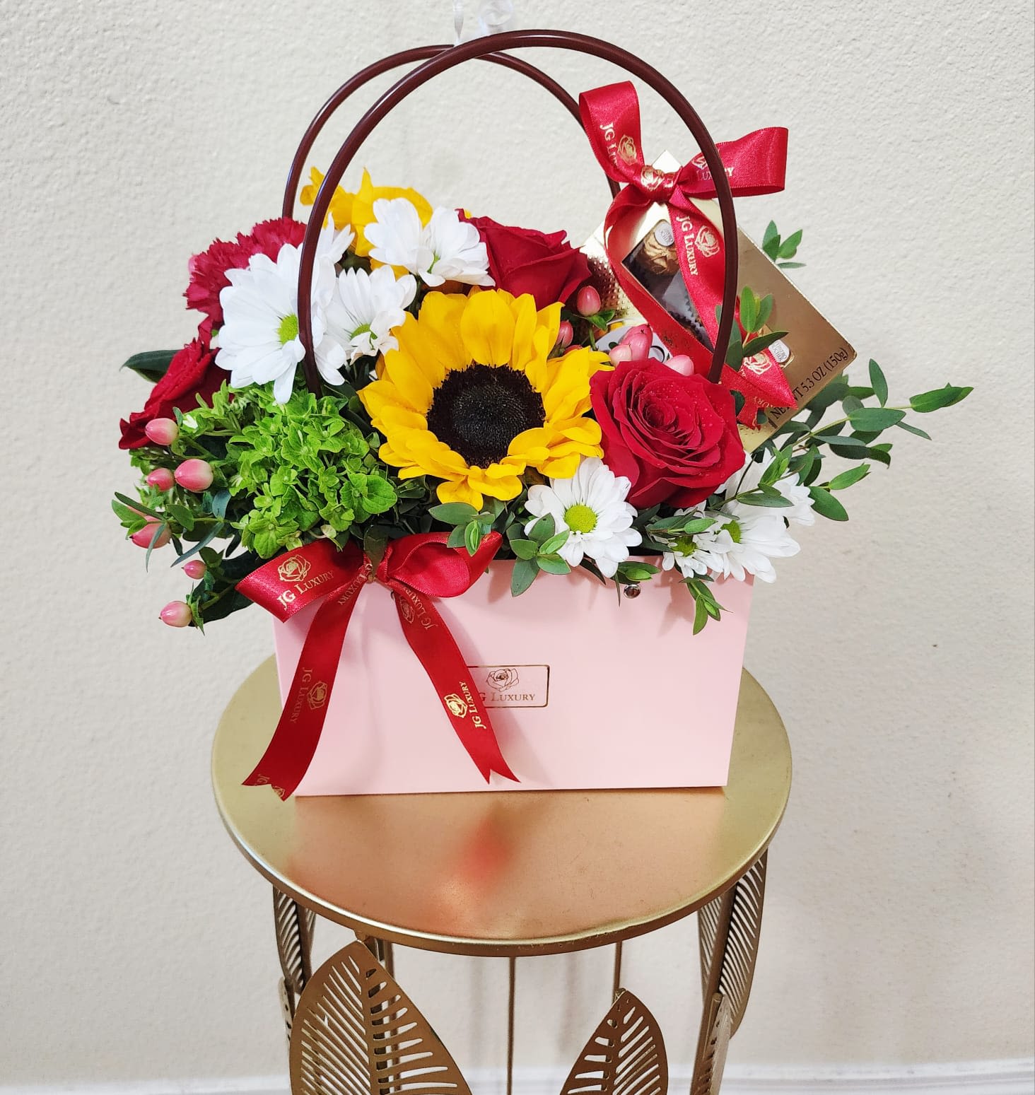 Handful of Love - This lovely handbag full of flowers with a box of chocolates is the sweetest gift you could choose for the occasion of your choice.