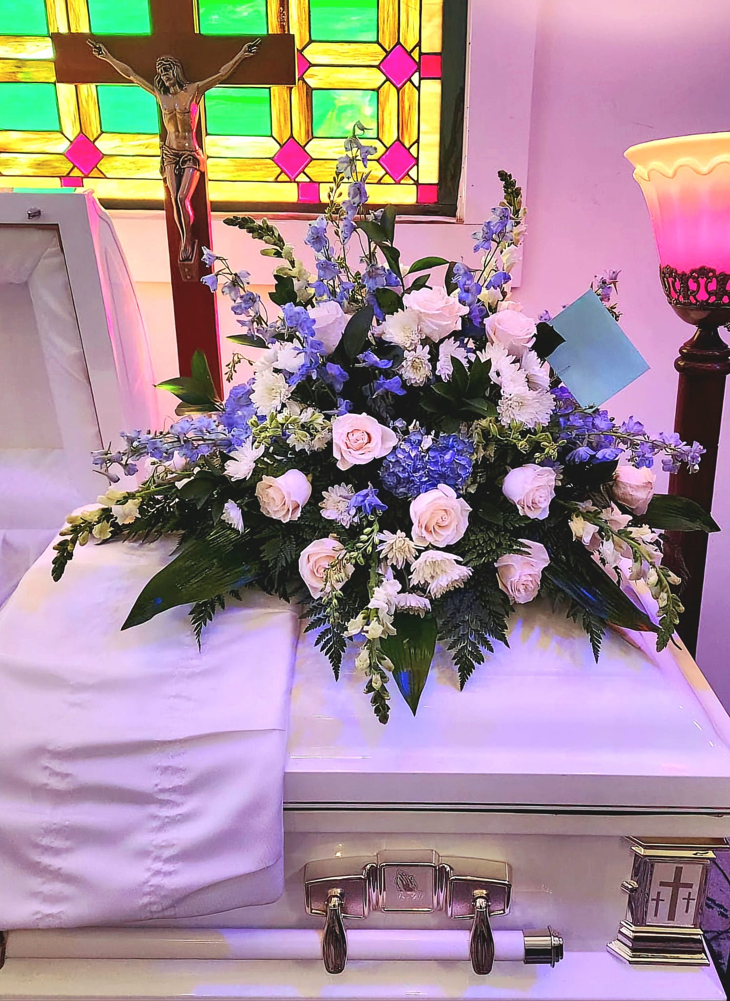 Timeless Essence Casket Spray - An arrangement that provides solace through grief.