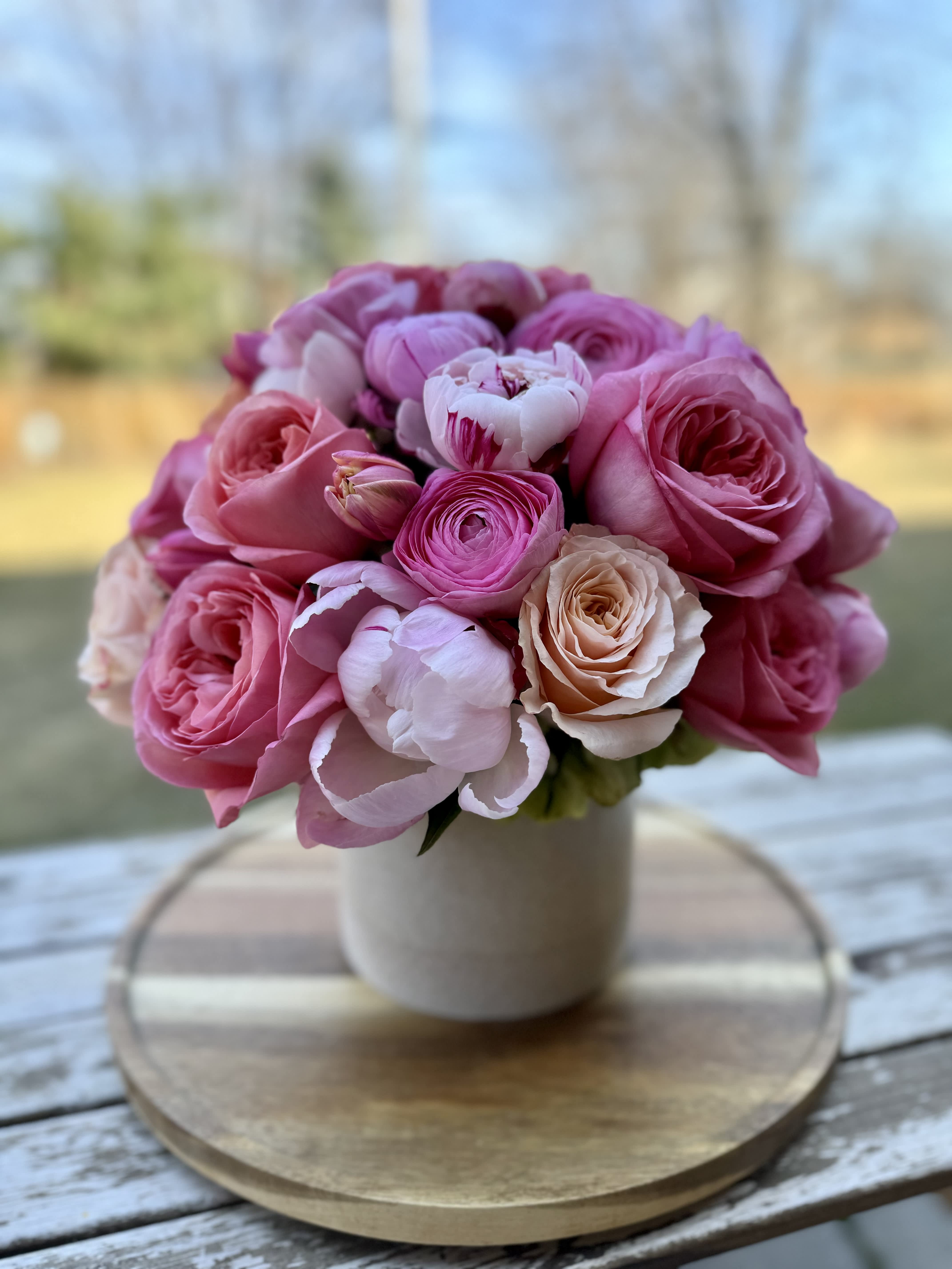 Pink Sunset - A mix of pinks with a kiss of peach. This is perfect for any peony lover, with a dozen peonies, mixed roses and ranunculus.