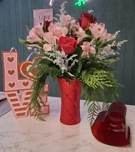 Romeo Oh Romeo - A timeless expression of love designed to steal hearts. Romeo Oh Romeo features a striking red sculpted tall vase filled with luxurious red roses, graceful alstroemeria, and airy solidago for a touch of golden charm. Elegant, passionate, and full of romance—this arrangement is perfect for sweeping your sweetheart off their feet.