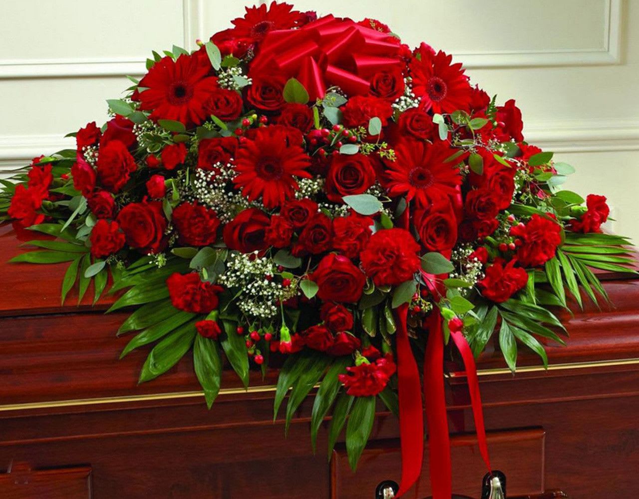  All Red Casket Spray - All red casket spray made with Roses, Gerbera Daisies, Carnations, Hypericum Berry and fillers.