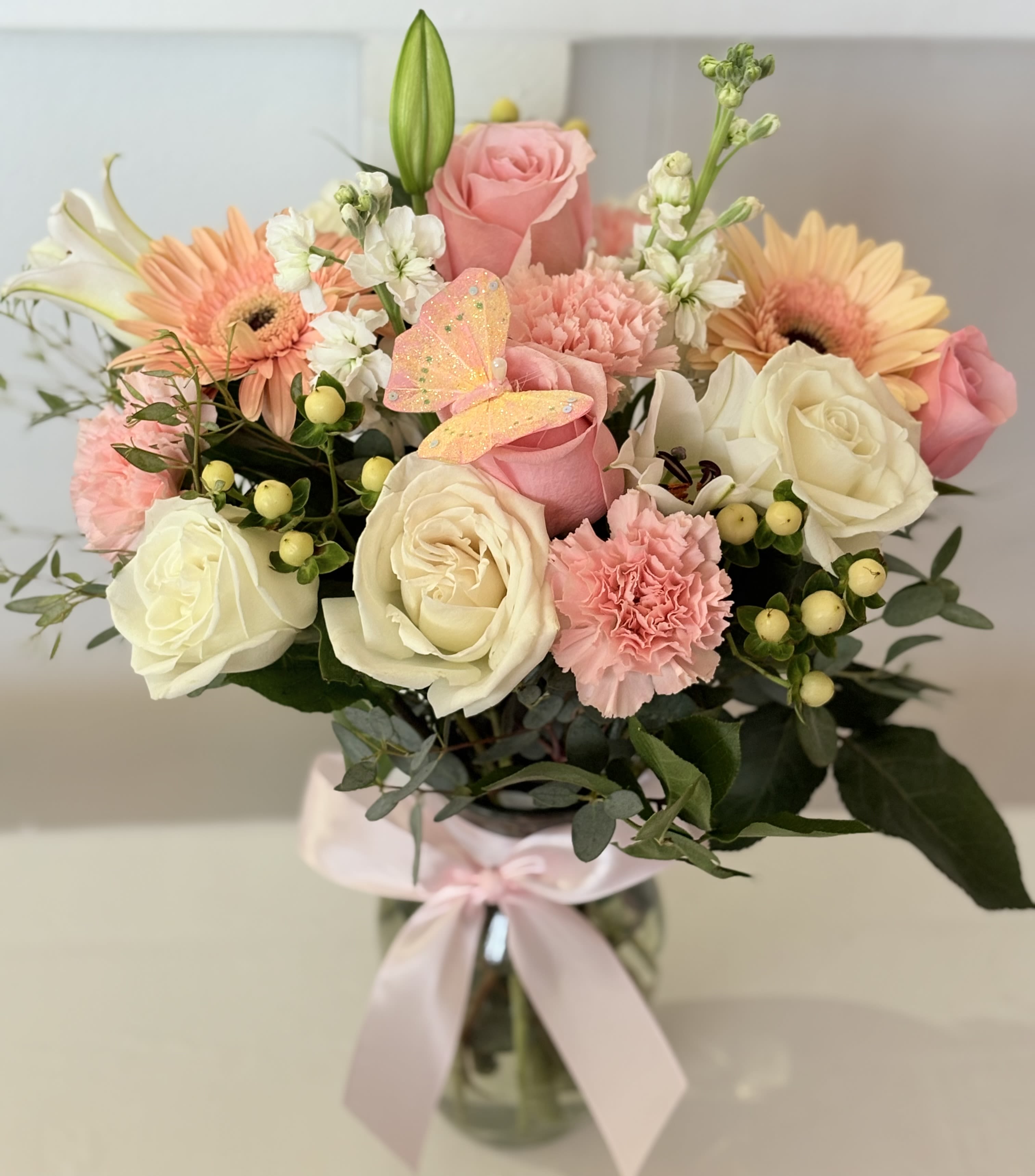 Linda - The name is fitting for a pretty bouquet of roses, stock, lilies, and gerbera daisies arranged in a vase. Measures approximately 20-23 inches in height. 
