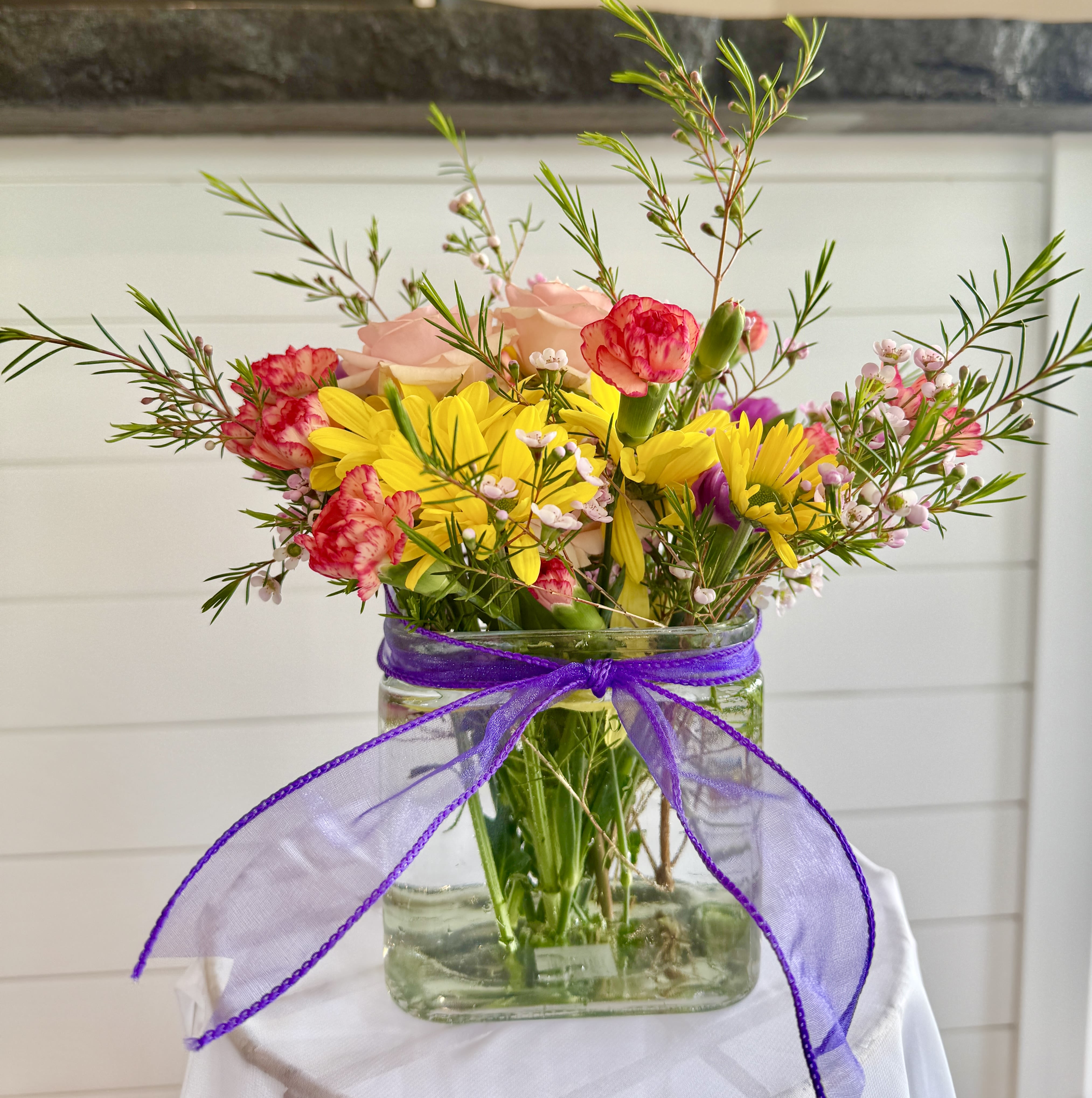 I love you, Mom - The most heartfelt way to say "I love you, Mom" is with this mixed cube arrangement. Choose from a beautiful variety of flowers and colors to make it truly special. Don't forget to share your mom's favorite color or flower with us—we want to create something she’ll cherish forever!