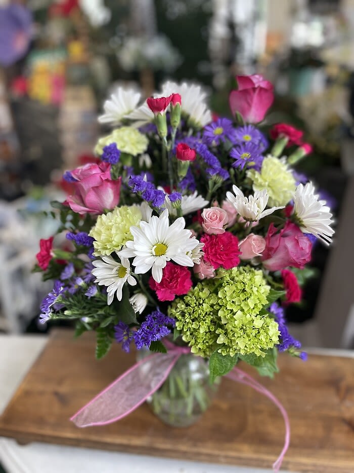 Isn't She Lovely - Isn't she lovely bouquet has mixed flowers including mini green hydrangea, roses, mini carnations, daisies and monte casino.  (Substitutions may have to be made for flowers or colors but we will make sure the full monetary value is included)