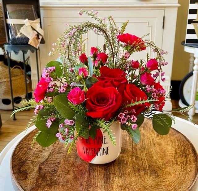 Be Mine, Valentine Custom Arrangement - Be Mine, Valentine is a Posies by Patti designer made custom bouquet! This arrangement comes in a mug size container and consists of roses, carnations and flowers put in the shape of a heart! This bouquet is different and is sure to surprise the one you are buying them for! 