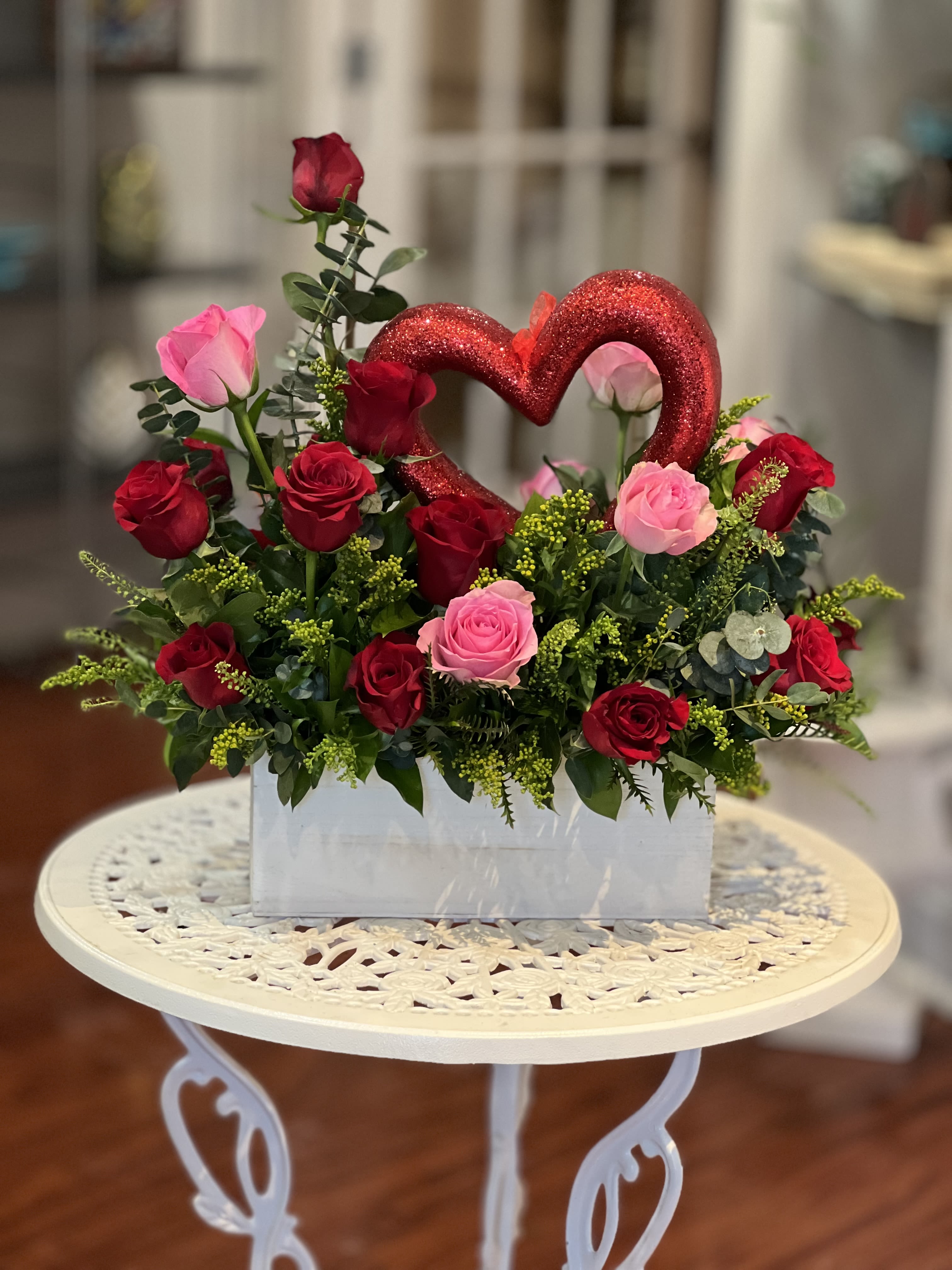 Rouge Amour - Designed with 24 stem roses, each stem representing a meaningful moment of love and passion.