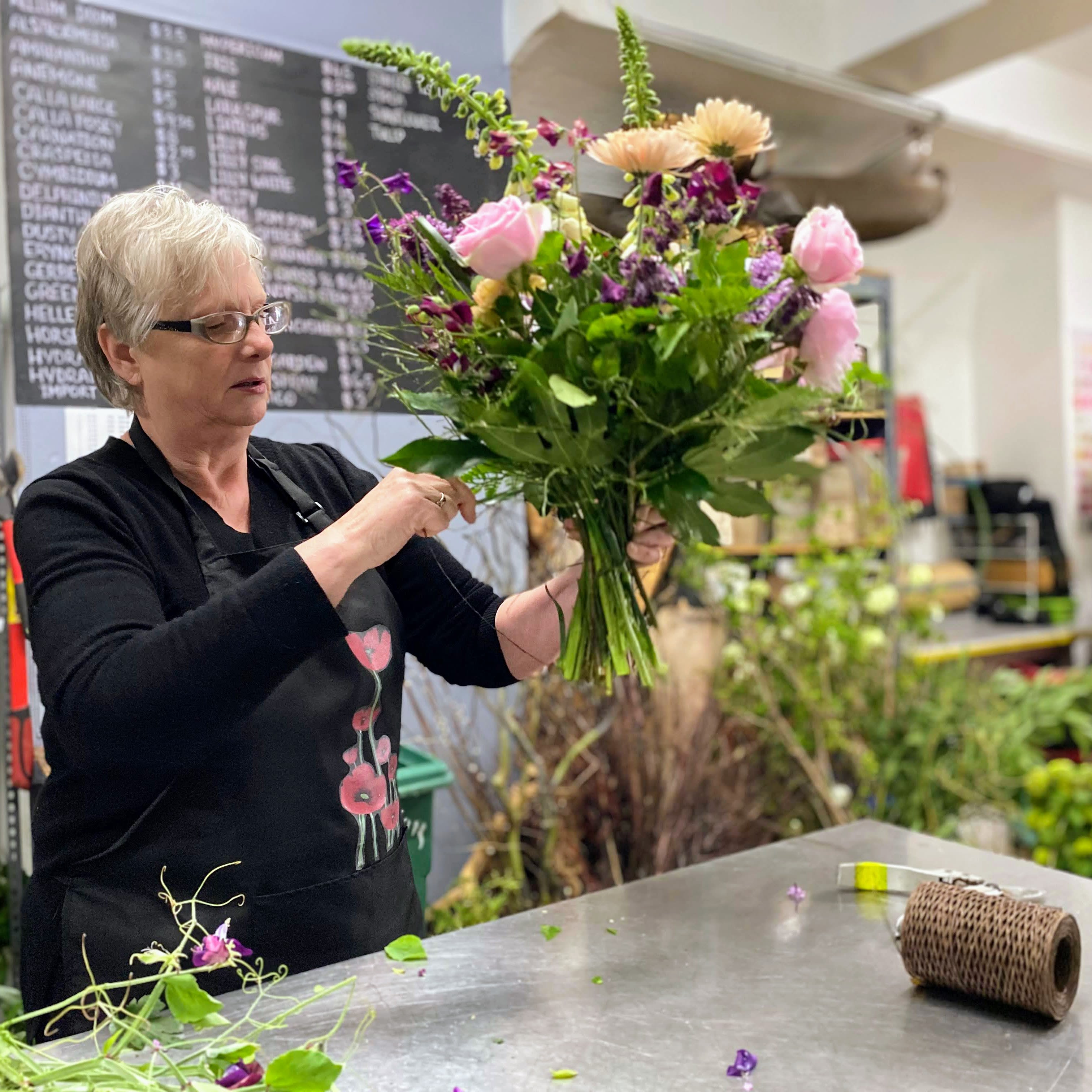 #6 Hold My Hand-tied Bouquet - Wrapped flowers that shout "Happy Valentine's Day!"  Our little Cupids will create a beautiful armful of fresh spring flowers that your loved ones can put into their own vase at home. We will wrap them up in paper with a temporary water source around the stems so they arrive nice and fresh!
