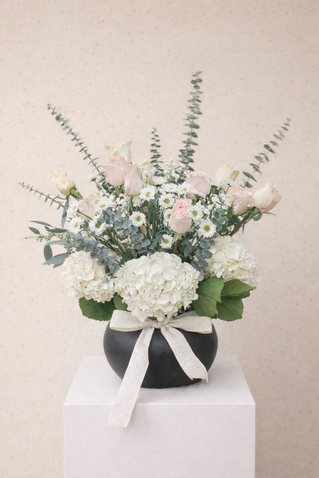 Gentle bloom - Beautiful mixed flowers in a pottery vase 