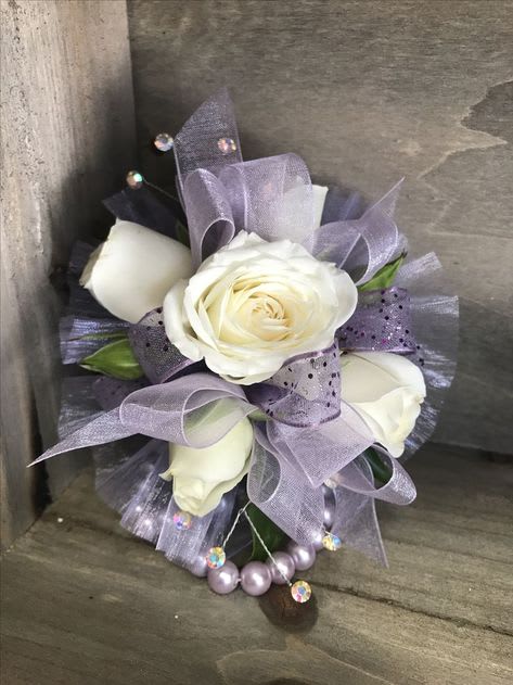 Wrist Corsage  -  Beautiful  corsage for prom,  or any special occasion.  Please call to discuss the colors of ribbon and other accents, 