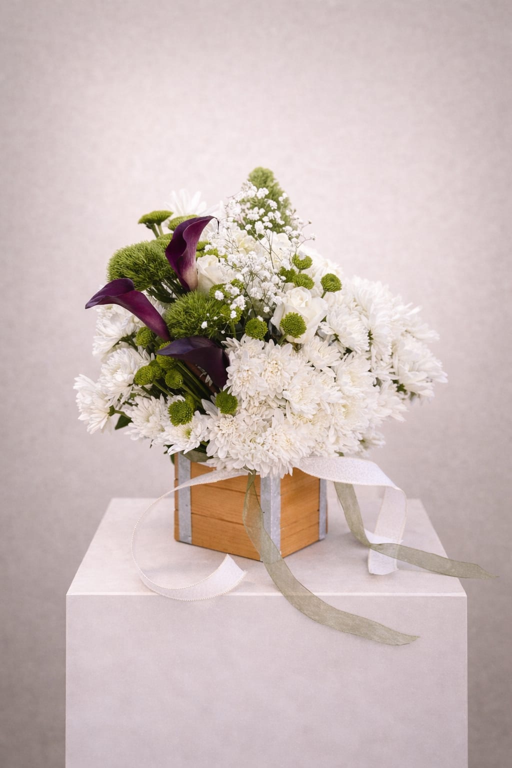 White Nest - White and green arrangement with a touch of purple in a wooden box 
