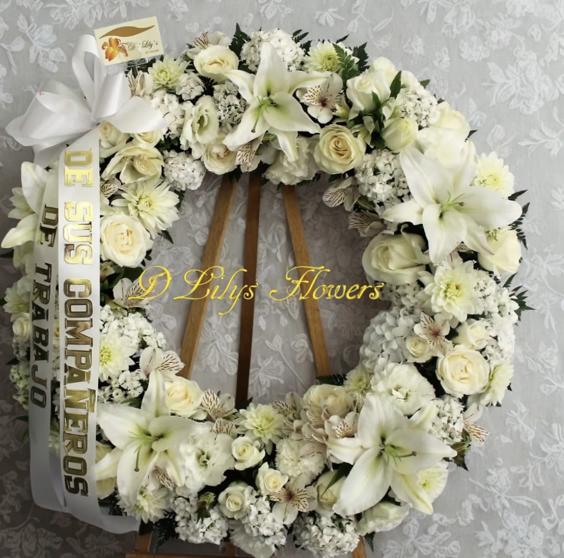 Heavenly Scent - This wreath gives off a serene appearance in all tones of white natural flowers.                     DOES NOT INCLUDE RIBBON