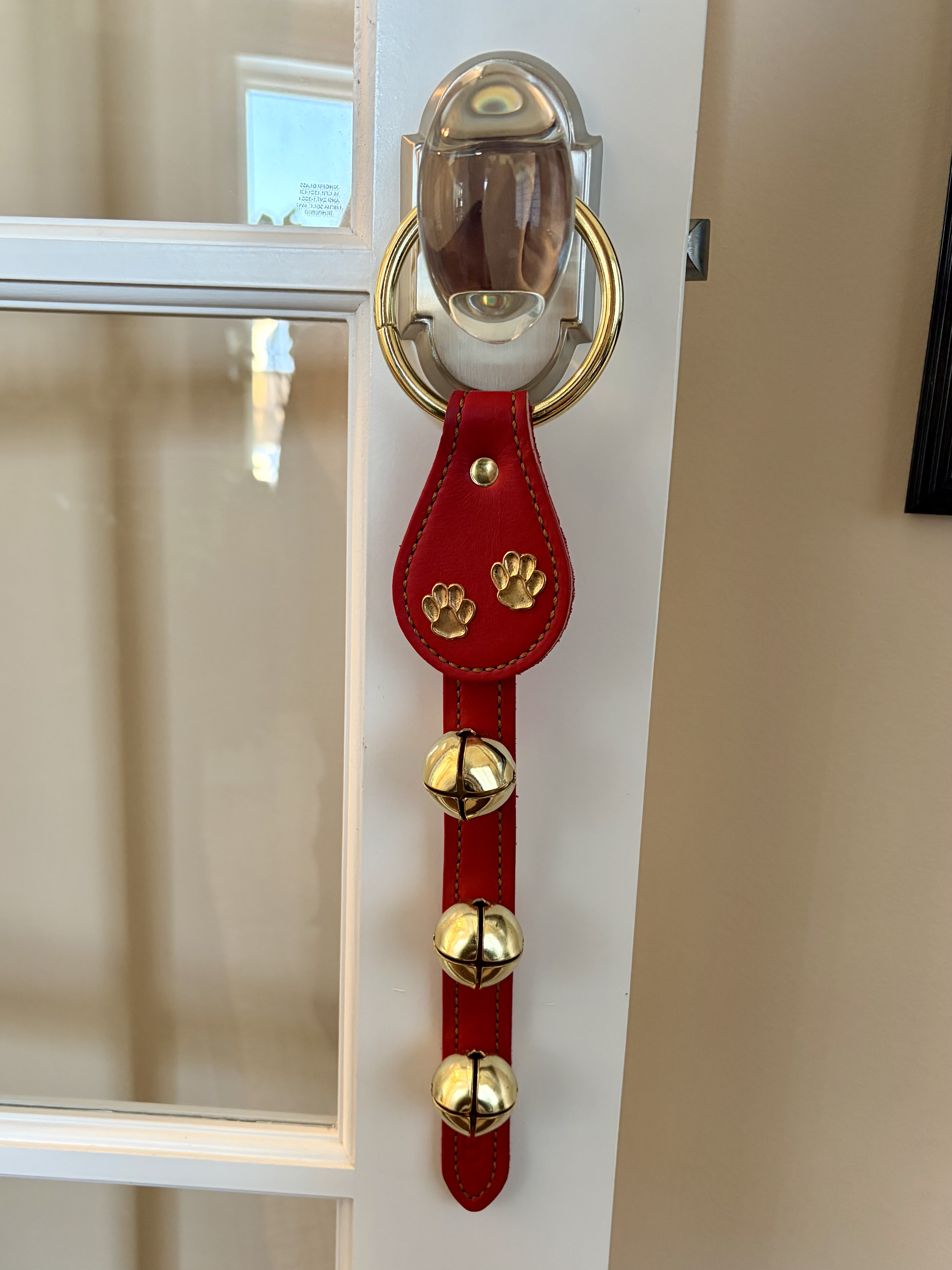 Limited Edition: Pet Doorknob Hanger with 3 Brass Bells (Red) - • Handcrafted Leather Top Doorknob Hanger • Features brass paw print design &amp; 3 brass bells • Great for door alerts, pet alerts, and decor