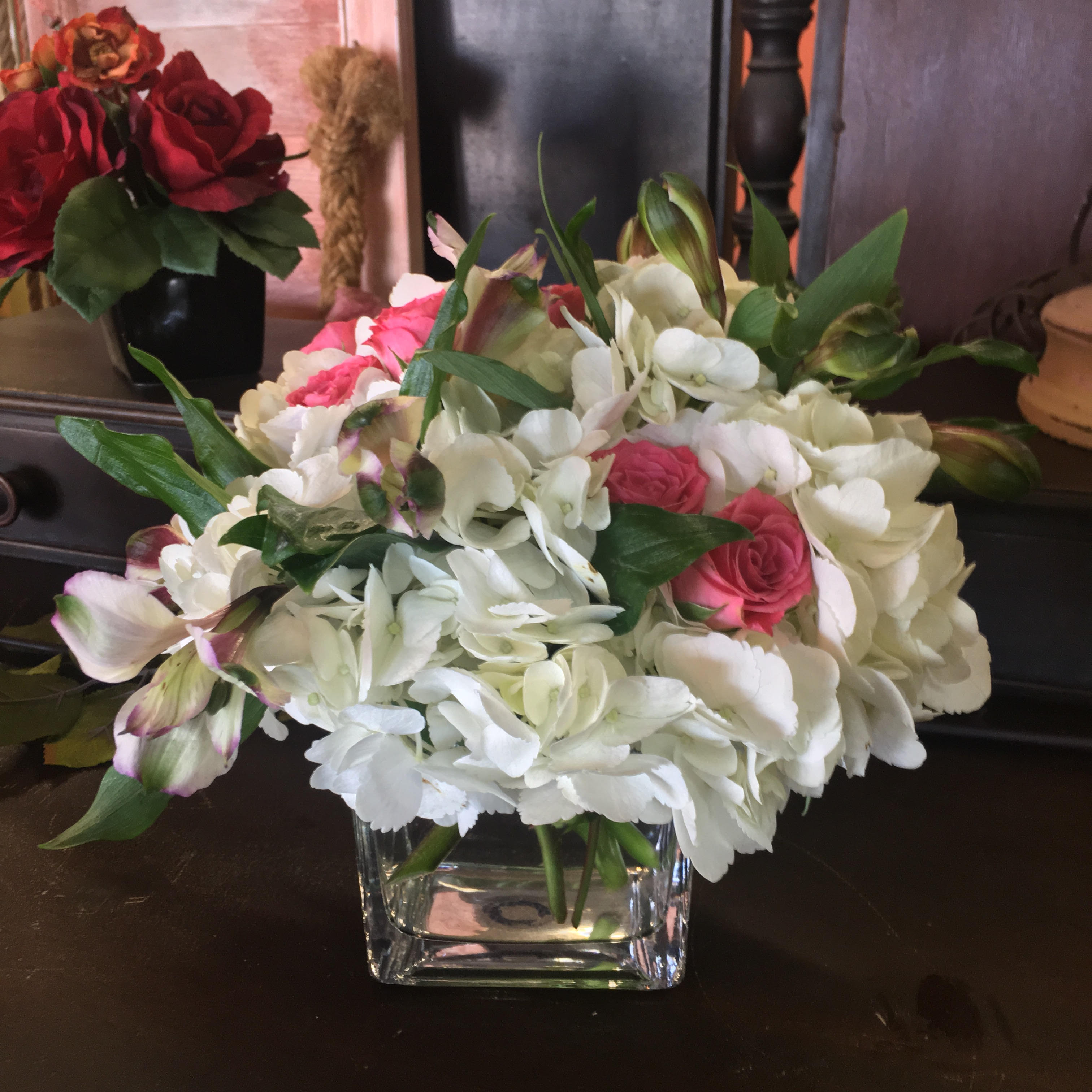 Sweet Thoughts - Tell her you're thinking of her with this tender arrangement; includes a white Hydrangea, miniature garden roses and a touch of Peruvian lilies in a low vase. Colors may vary
