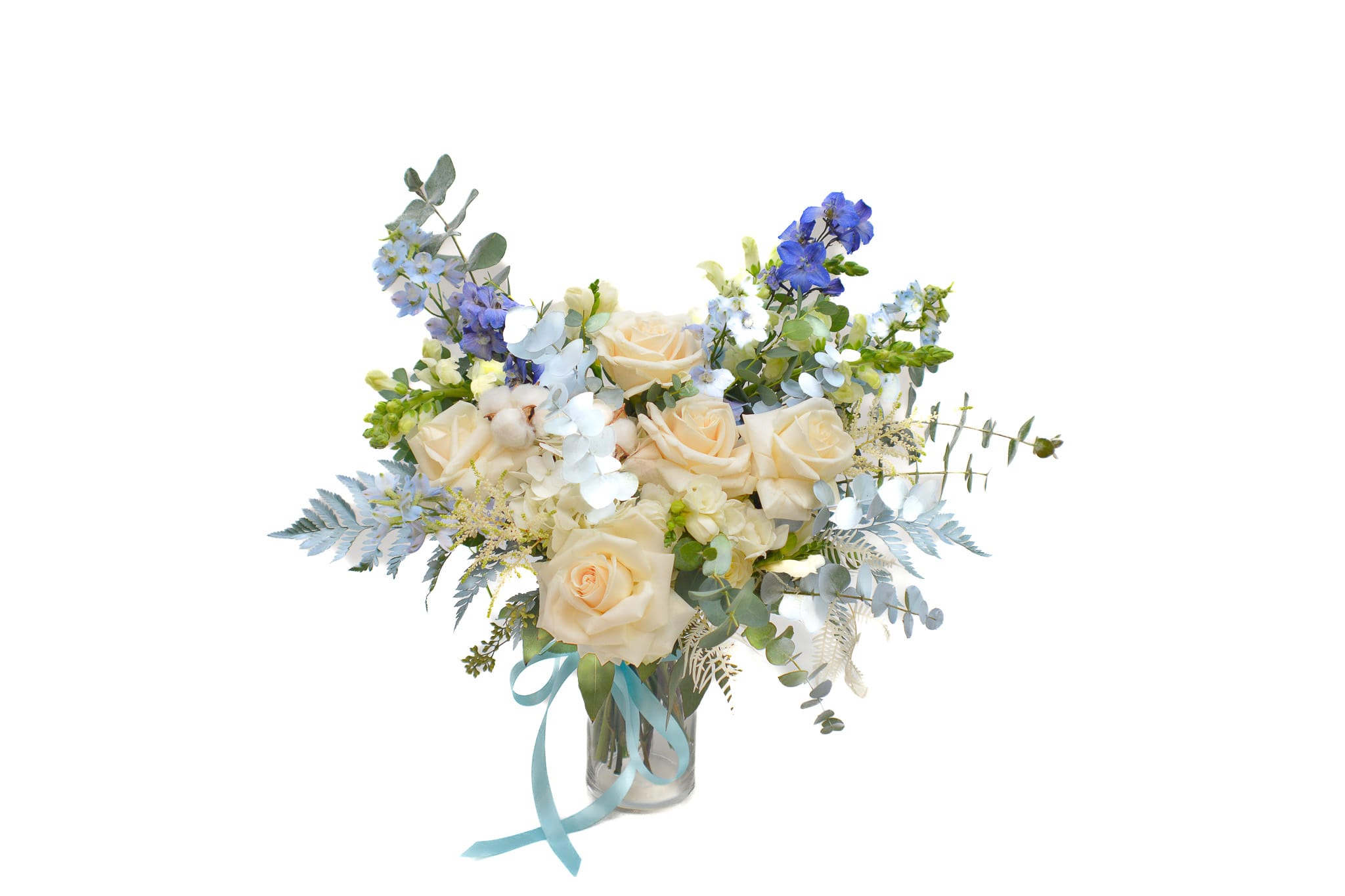 Charlotte - Take a dip into a towering display of blue delphinium and white roses with Charlotté. Sensitive and simple combination of color, perfect for any occasion. Light blue delphinium, snow white freesia, delicate white ranunculus and sensitive white roses, makes this bouquet unique and so special. Blue flowers, stands for desire, love, and the metaphysical striving for the infinite and unreachable. It symbolizes hope and the beauty of things.