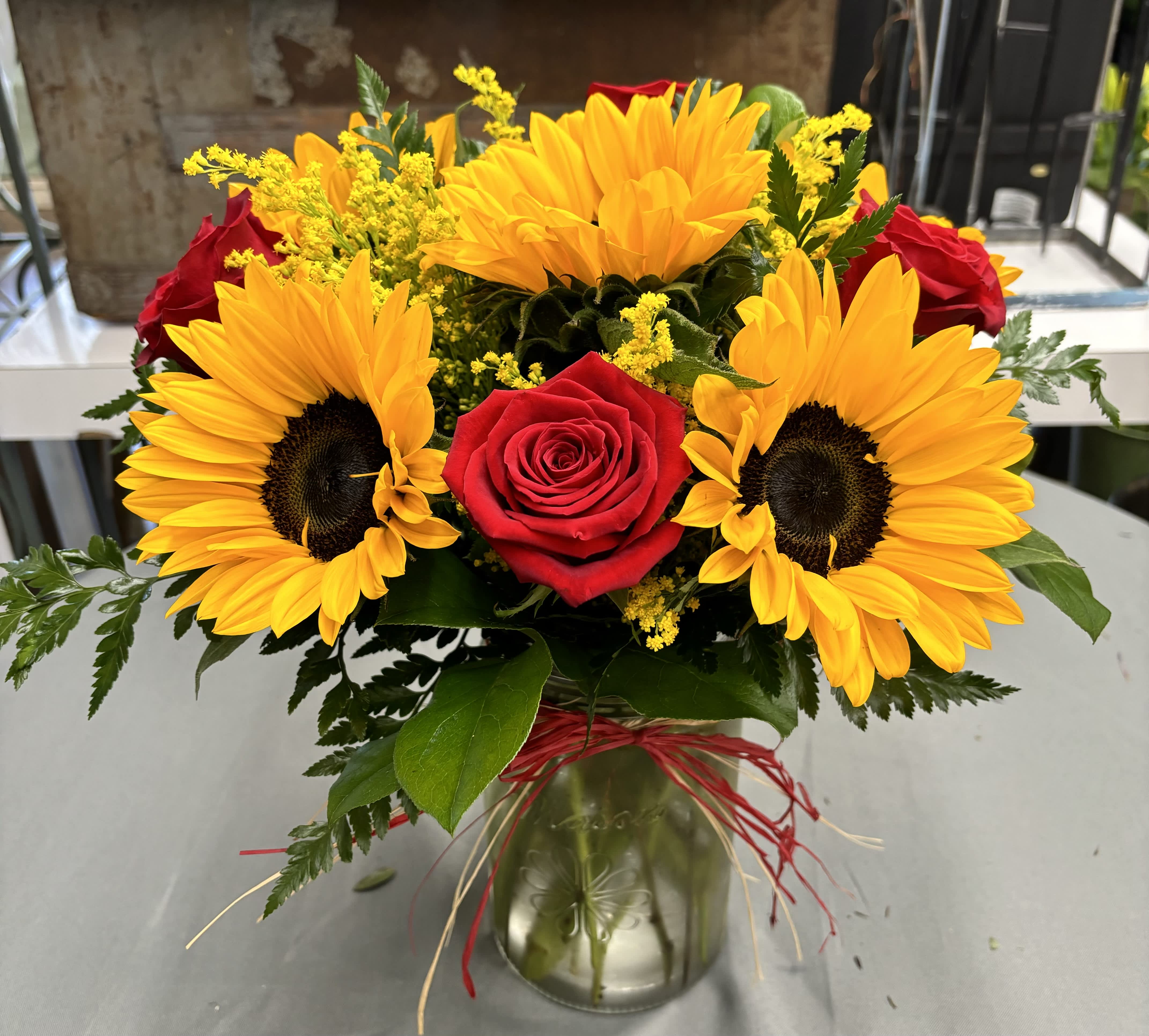 Sunflower Love by Daisy - Sunflowers with red roses. 