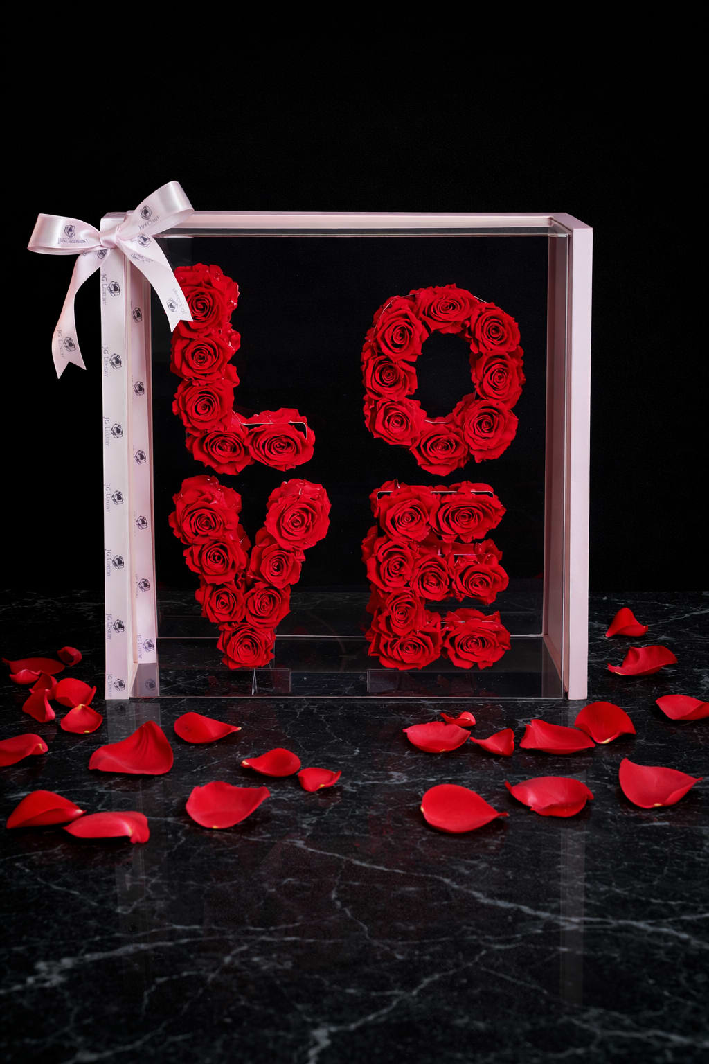 L O V E - Luxury Collection  - Preserved Roses in a Pink Box: Globally renowned for their beauty, longevity, and timeless elegance. Hand-picked at peak bloom, each rose is preserved with advanced techniques to maintain its vibrancy and freshness from one to three years. Known for exceptional quality and luxurious presentation, they make a stunning gift or decorative piece.