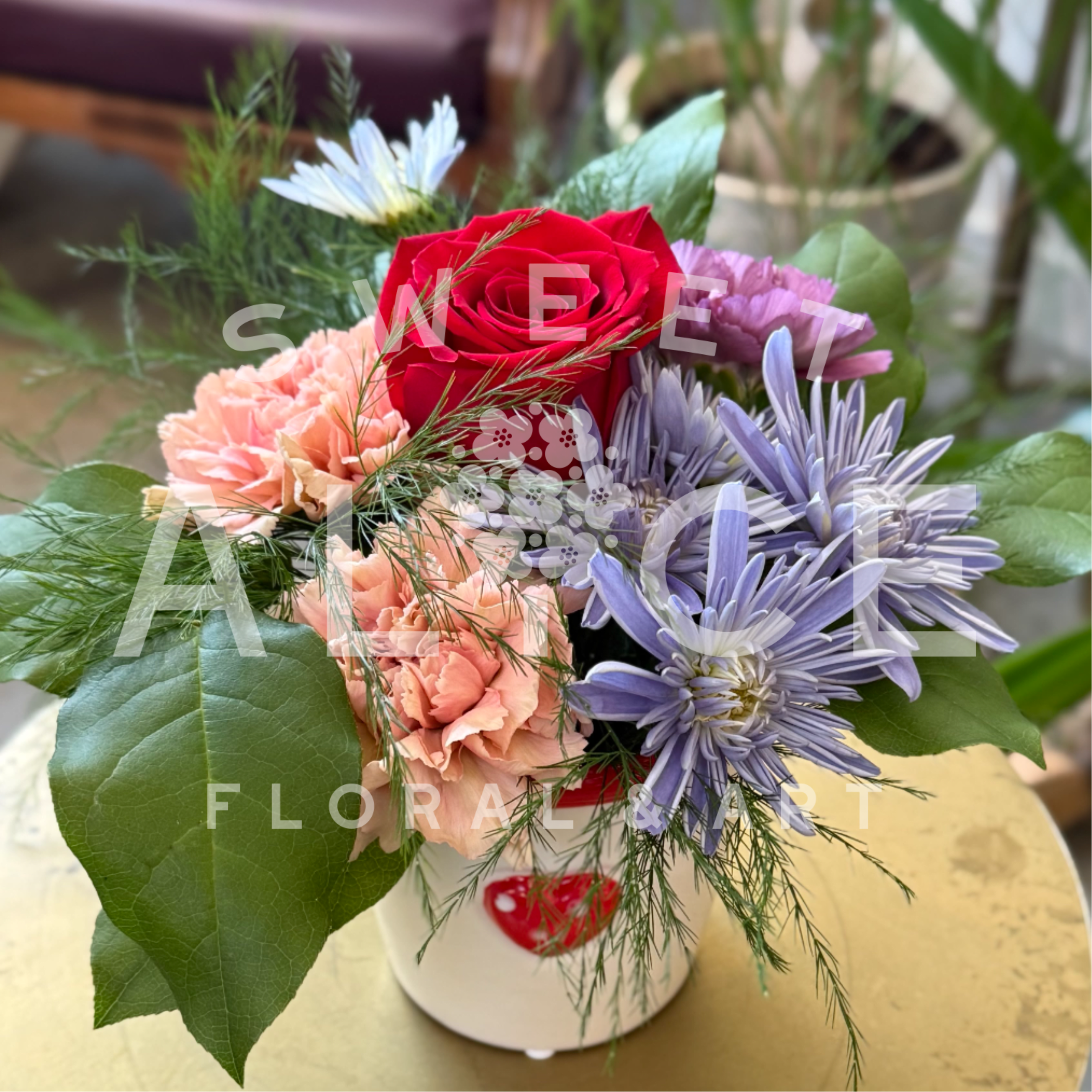 Seasonal Rose Garden Pot - A lovely little arrangement starring everyones' favorite flower, the rose.   Please note, colors and fill flowers will vary based on available stock.