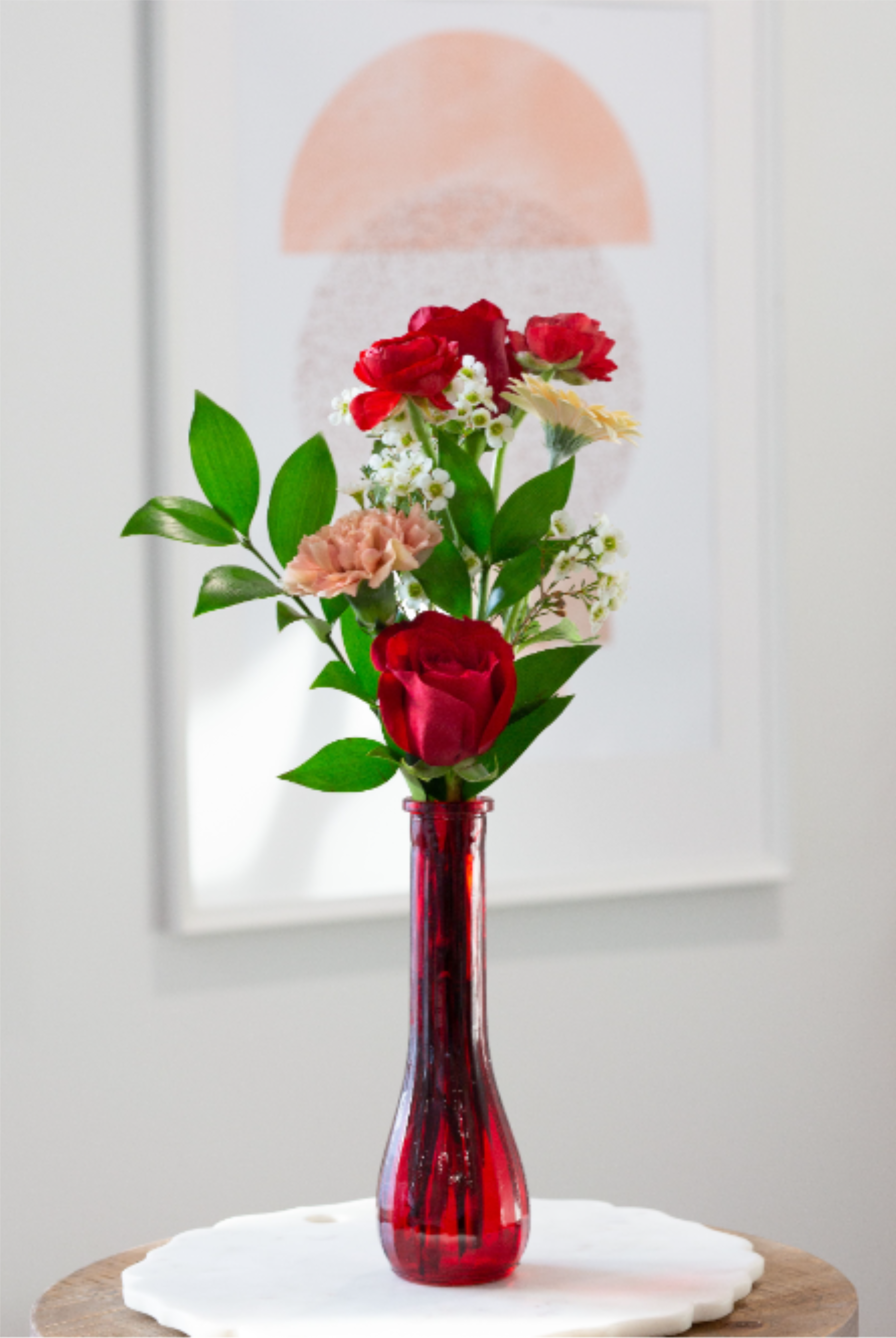 Beautiful Budvase  - A red glass budvase filled with beautiful floral blossoms.