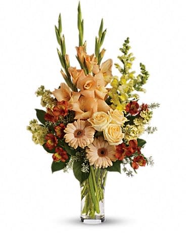 Summer's Light Bouquet - Express your condolences in tasteful shades of color with peach, orange and yellow flowers in a stylish trumpet vase. For the service or the home, it is an elegant choice. The stunning bouquet includes peach roses, peach gerberas, orange alstroemeria, peach gladioli, yellow snapdragons and yellow stock, accented with assorted greenery. Delivered in a glass trumpet vase. 