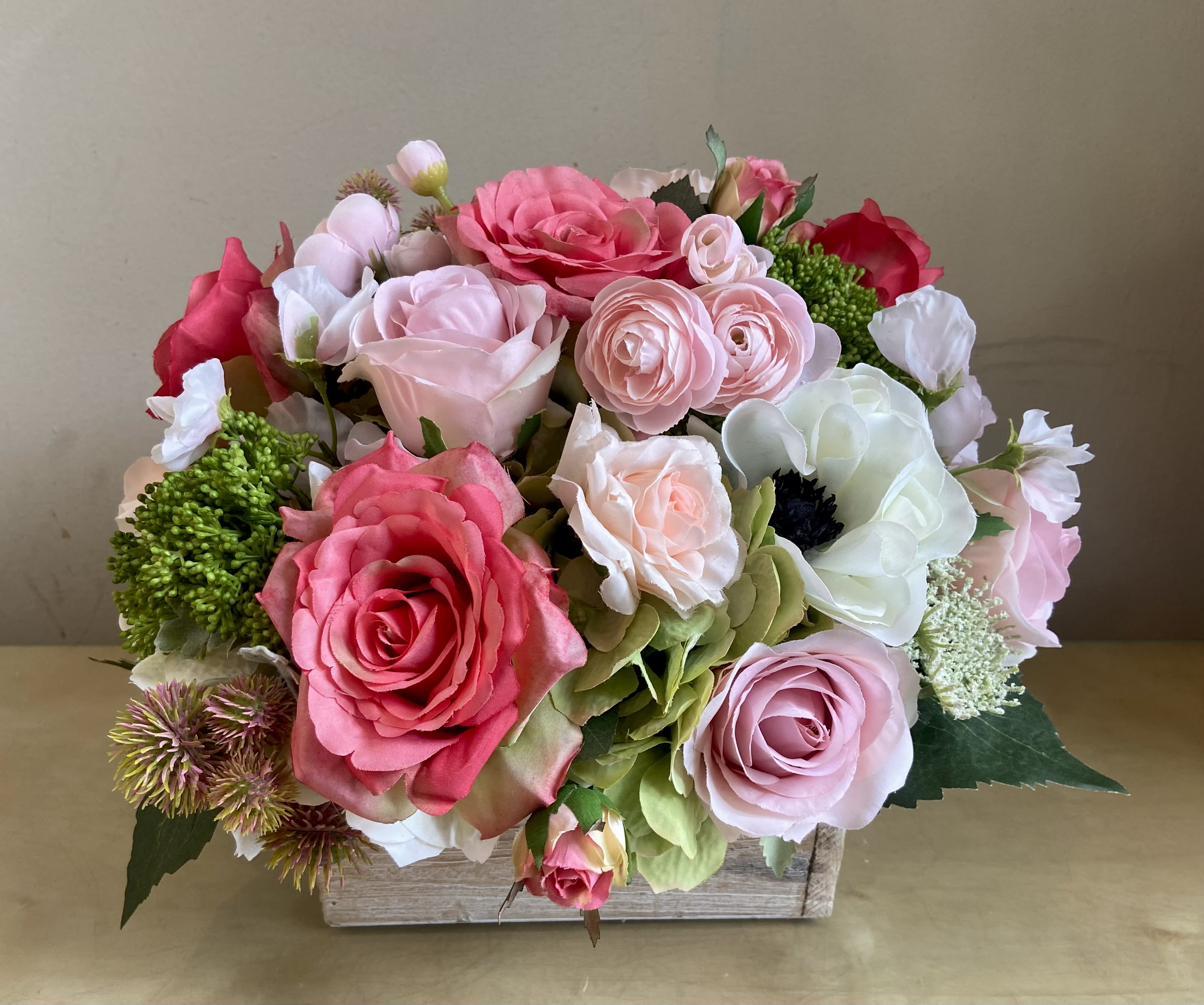 Garden Romance - Lush silk floral arrangement with romantic flower combination looks so natural. Hydrangea, roses, ranunculus, anemones, sweet pea &amp; more in a natural wood container.