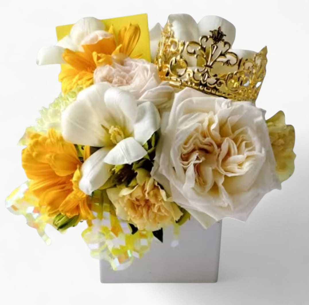 Vanilla Beauty Blossoms Bouquet Designer's Choice - Send this pretty beauty today to make them smile with it's vanilla and pale yellow blossoms of that day roses and more arranged in a white modern glass vase adorned with a gold crown. Perfect to send today for every occasion. All bouquets are always made extra special and unique each and every time. Send happiness. Please check out my beautiful gallery which showcases my most recent designs that I have created for my online customers.
