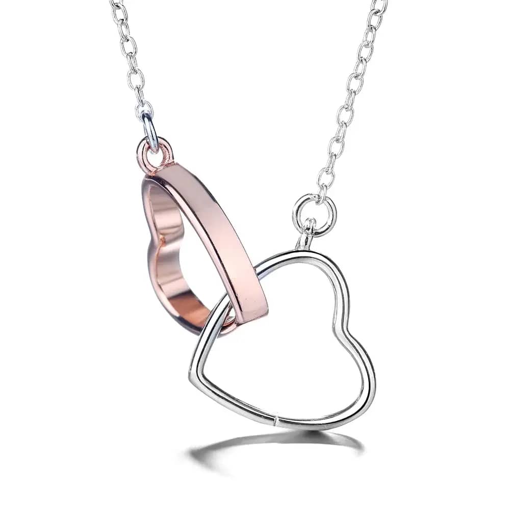 14k Rose Gold and Sterling Silver Double Heart Pendant Necklace - The 14k Rose Gold &amp; Sterling Silver Double Heart Pendant Necklace is a beautiful and romantic piece of jewelry that features two intertwined hearts on a delicate chain. The necklace is crafted from high-quality 14k rose gold and sterling silver, which give it a stunning and unique appearance.  The two hearts on the pendant are intricately intertwined, with one heart crafted from rose gold and the other from sterling silver. The contrast between the two metals creates a beautiful and eye-catching design, with the warm pink hue of the rose gold contrasting beautifully with the cool silver tones of the sterling silver.  The pendant is suspended from a delicate chain that is adjustable in length, allowing for easy customization to the wearer's desired fit. The chain is crafted from sterling silver, which is both durable and hypoallergenic, making it suitable for even the most sensitive skin.  The 14k Rose Gold &amp; Sterling Silver Double Heart Pendant Necklace is perfect for adding a touch of romance and elegance to any outfit. Whether it is for a special occasion or everyday wear, the stunning design and high-quality materials make this necklace a timeless and versatile piece of jewelry that is sure to be treasured.    * Metal: Sterling Silver   * Plating: Rose Gold   * Lead- and nickel-free   * Hypoallergenic   * Size: N 18” P 30mm Diameter   * Closure: Lobster Claw   * Chain: Cable  