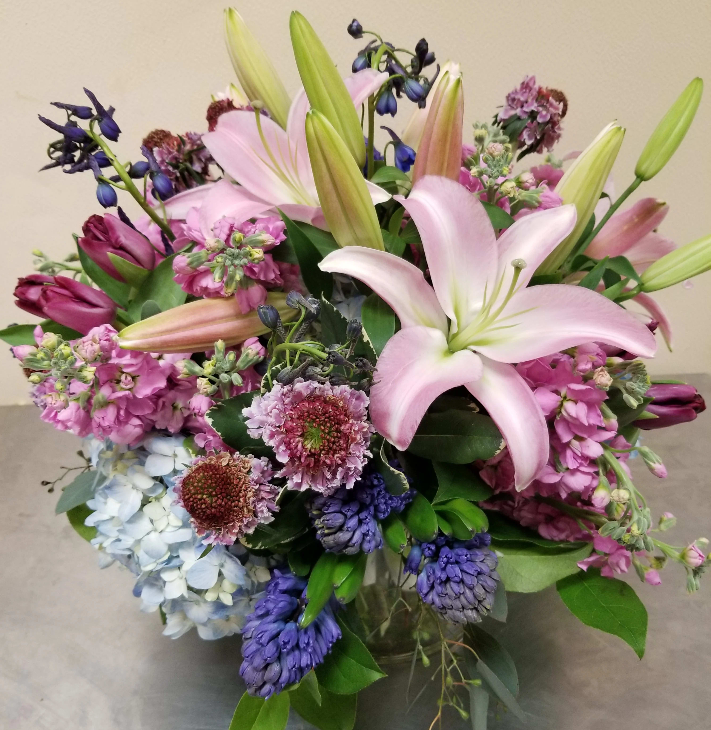"Jardin de Giverny" Bouquet - This elegant floral combination of lavender, blue, and pink blossoms is very reminiscent of a Monet painting. With its soft color palate and sweet fragrance, this bouquet will surely transport the recipient to Monet's favorite garden.   