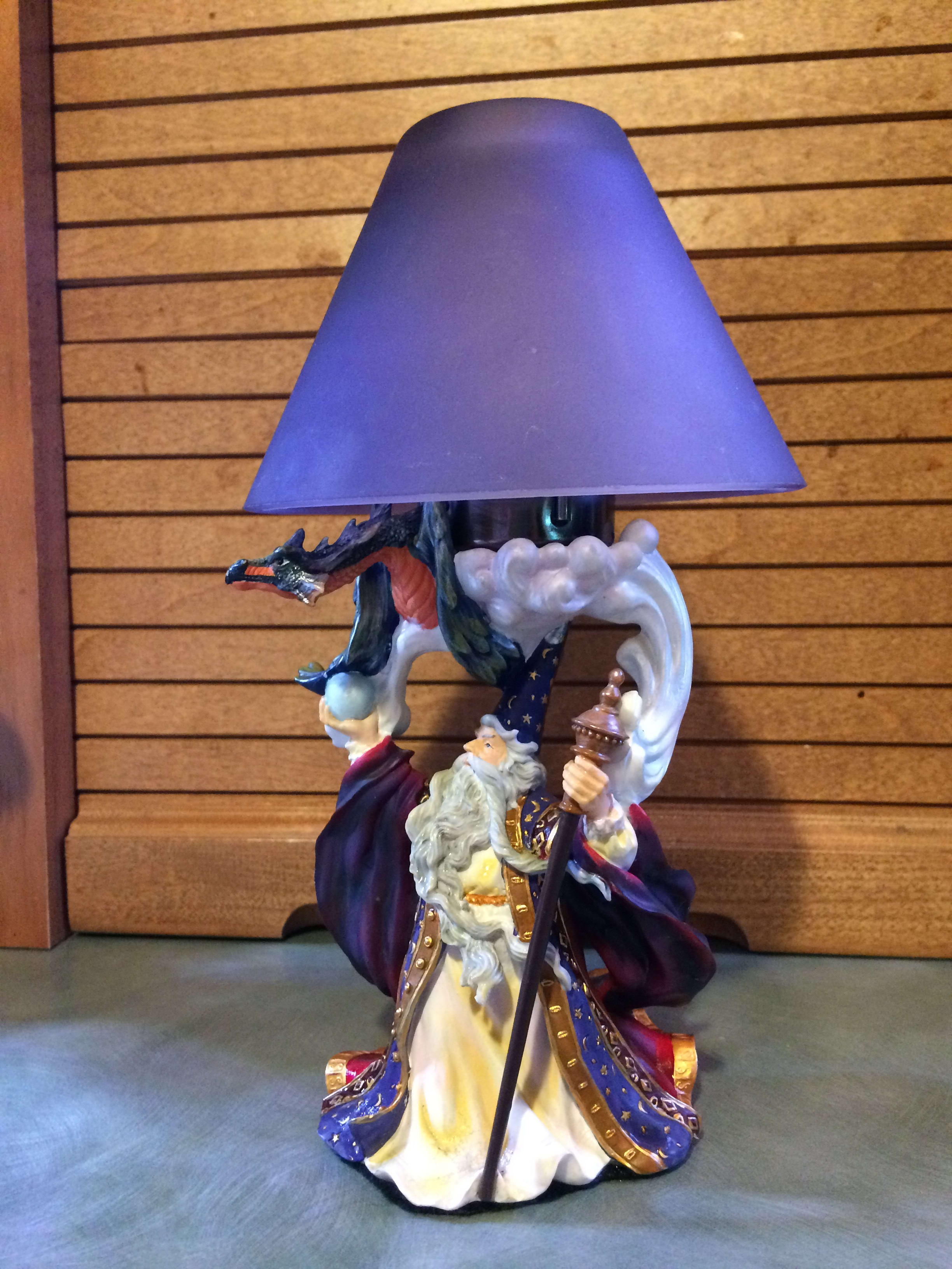 You Put A Spell On Me. - Enter the world of magic, spells &amp; potions with our colorful Medieval Sorcerer &amp; his Dragon. Cast of ceramic and holds a tea light candle. Removable Shade included. Pictures show you the front, back &amp; with shade removed for easy viewing. Included 1 tea light candle. (keep out of reach of children, pets, and flammable objects. Do Not leave candle unattended.) Approximate dimensions: 8 3/4" tall &amp;  5" wide. 