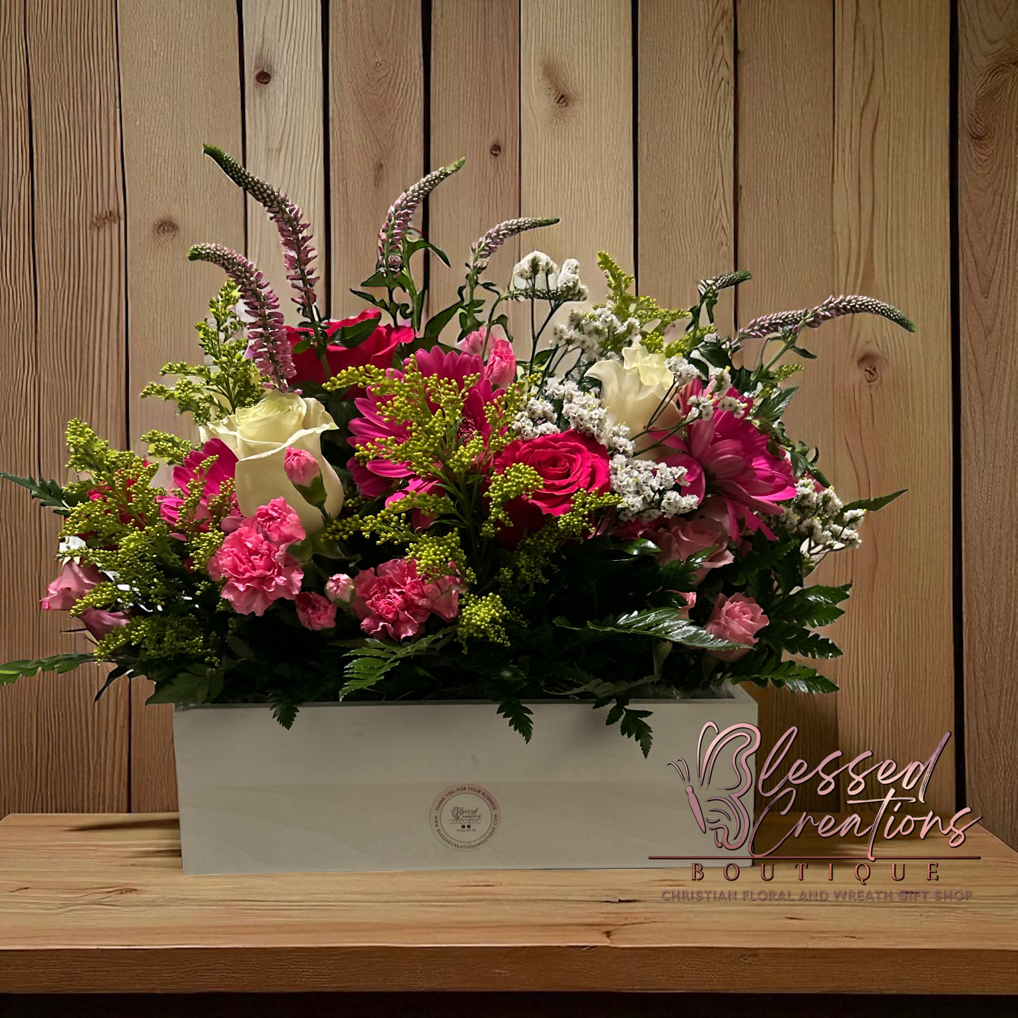 Graceful Radiance Box  - Celebrate life’s most meaningful moments with our Graceful Radiance Box – a handcrafted floral arrangement from Blessed Creations Boutique, your Christian floral and wreath gift shop in Valdosta, GA. This cheerful garden-style design features creamy white roses, vibrant pink roses, carnations, daisies, solidago, and lush greenery, beautifully arranged in a keepsake white box. Whether you’re sending birthday wishes, anniversary love, or uplifting encouragement, this floral gift brings joy and blessing to any occasion.  Enjoy same-day flower delivery in Valdosta, Lake Park, Lakeland, Quitman, and Hahira, GA. Perfect for gifting locally or surprising someone special with a meaningful touch of beauty.