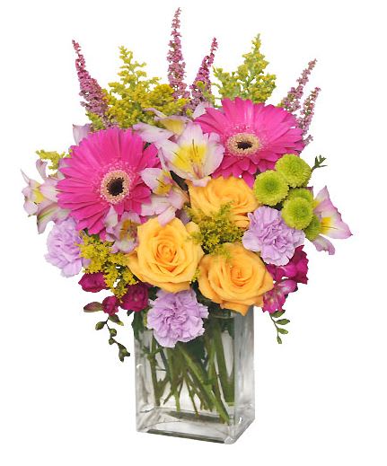 Fruit Cocktail - If you're looking for something beautiful and bright, you've come to the right place! This arrangement is full of vibrant flowers to brighten their day! With hot pink gerberas, golden yellow roses, pink carnations, and more, Fruit Cocktail is the perfect arrangement for that special person in your life.